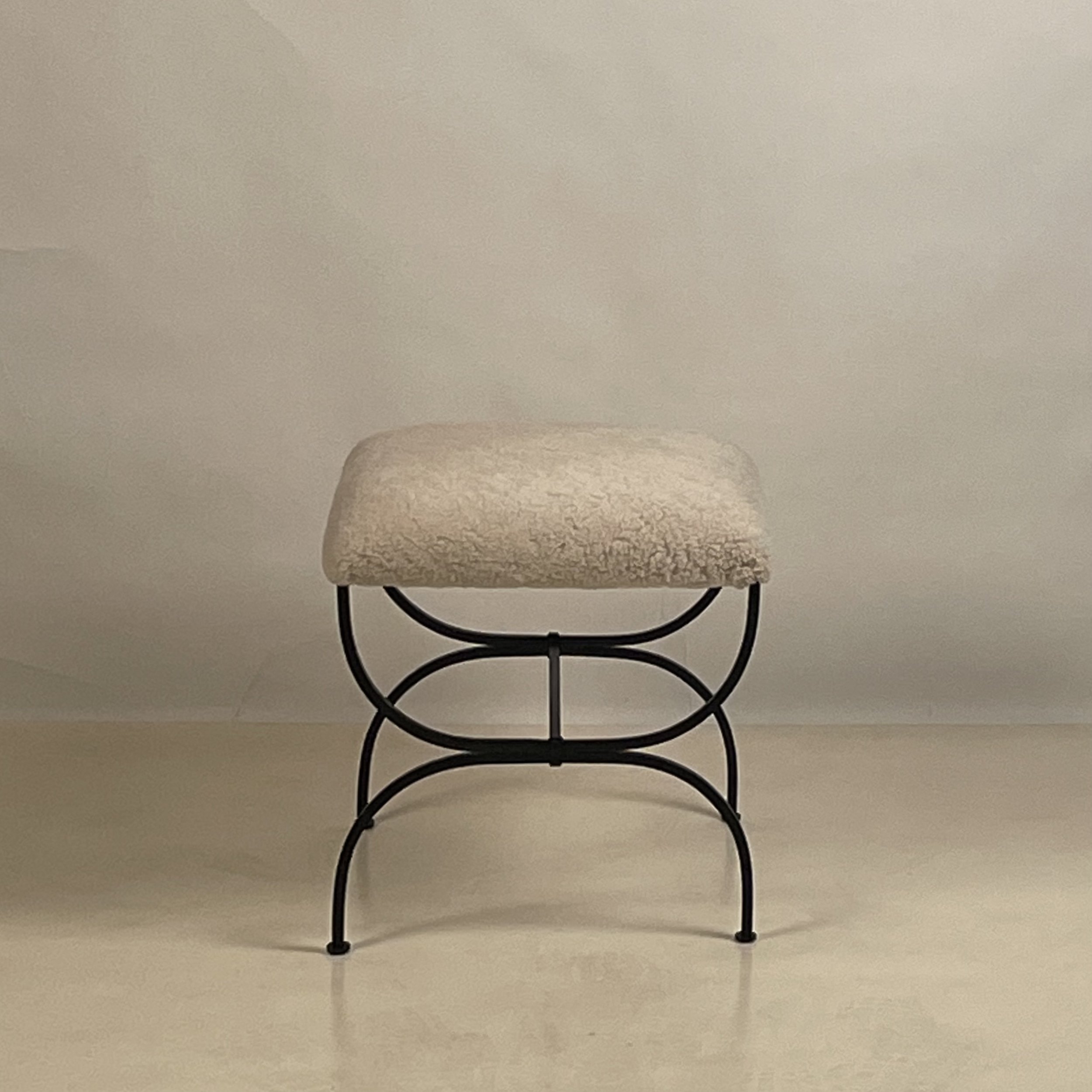 Pair of STRAPONTIN shearling stools (1).jpeg