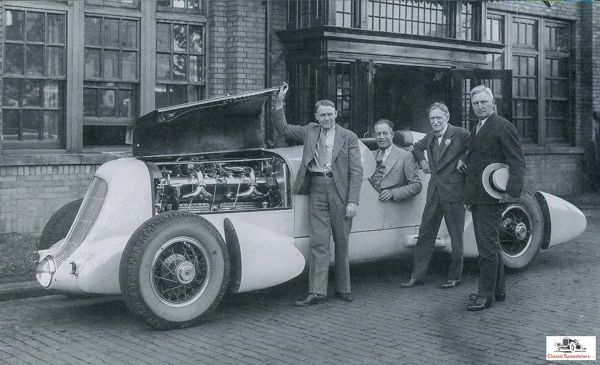 1935 Duesenberg Special. Seated is Jenkins, with designer Augie Duesenberg standing at left and Harvey Firestone at right. photo from Jenkins Family Collection, courtesy Gordon Eliot White