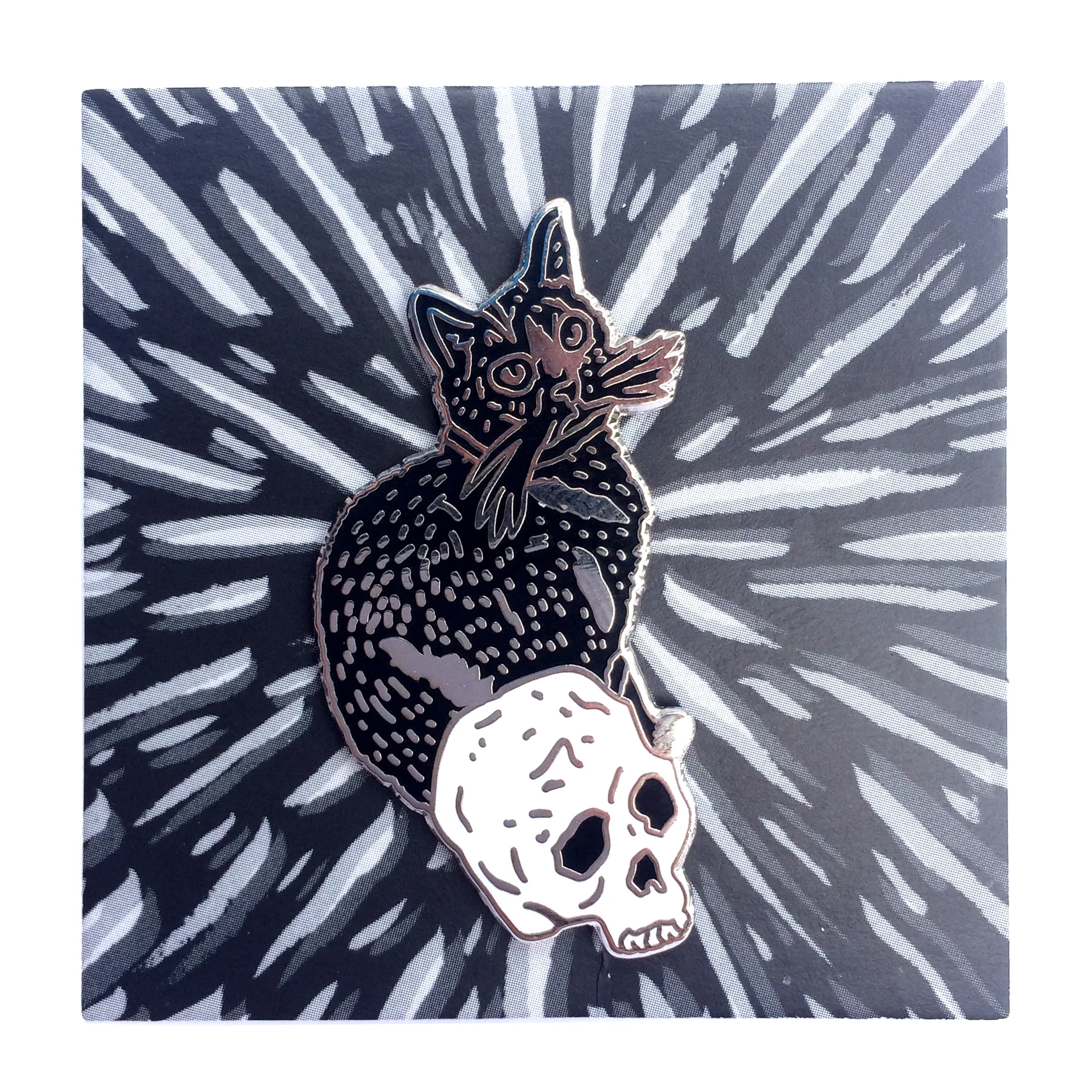 cat and skull pin on backing.jpg