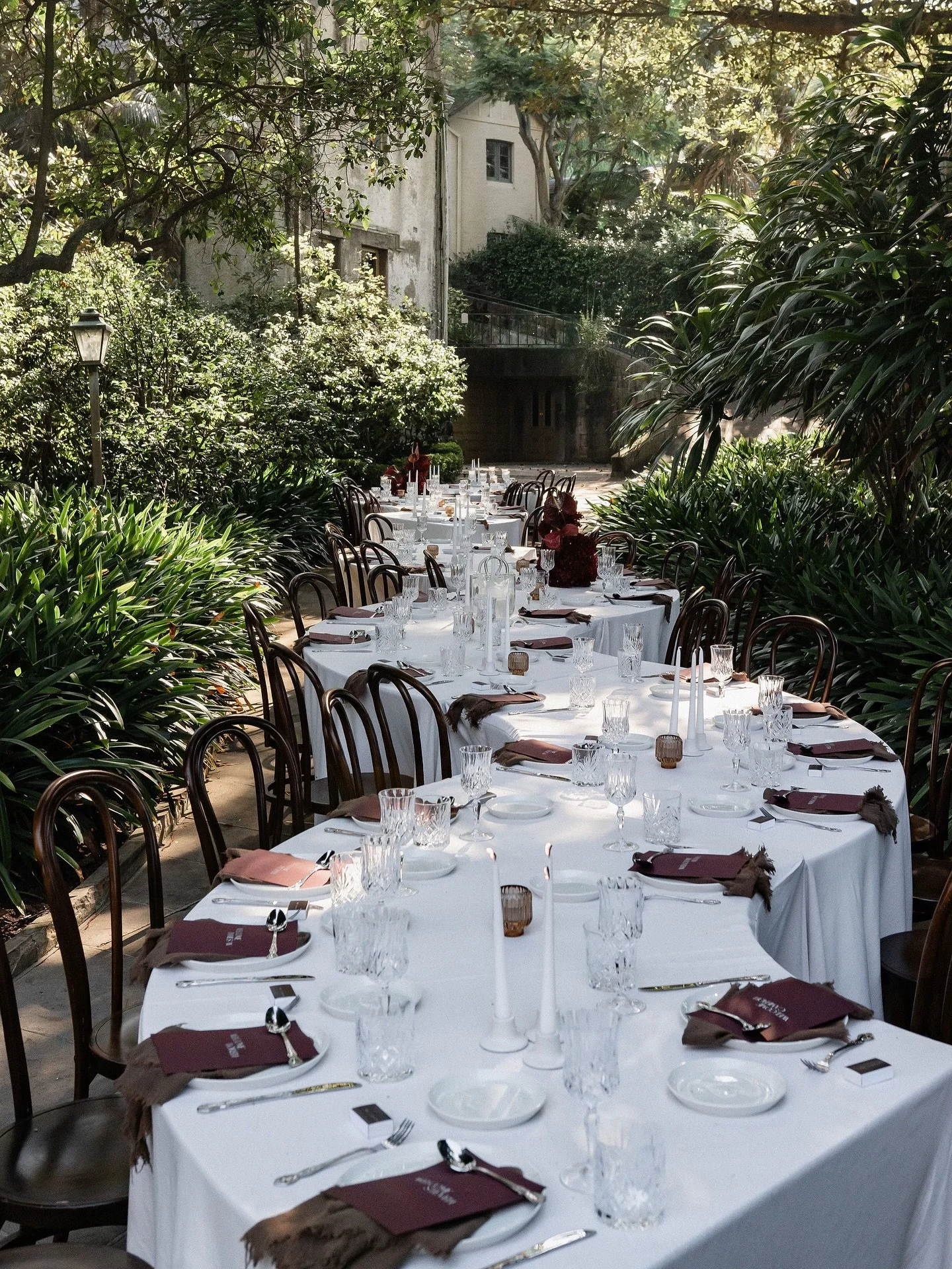 Understated elegance tucked within a private Sydney estate - layered crystal, rich garnet tones and candlelight spilling through the garden ✨

Highlights from E+C&rsquo;s celebration recently featured in @ivorytribe up now! 

Bride | @el_west
Groom |