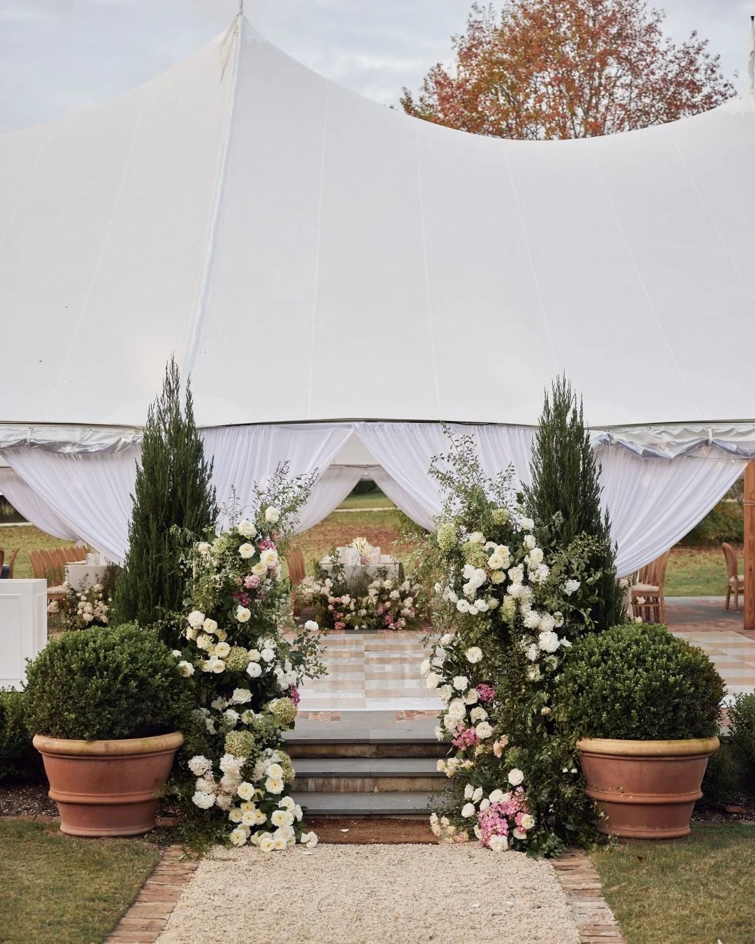 A garden entrance framed in sculpted greenery, delicate blooms, and bespoke dance floor at redleaf - a quietly refined moment for S+P, anchored in effortless elegance. 

Bride | @sophmarco
Venue | @redleafwollombi
Planner | @mrssmithweddings
Photogra