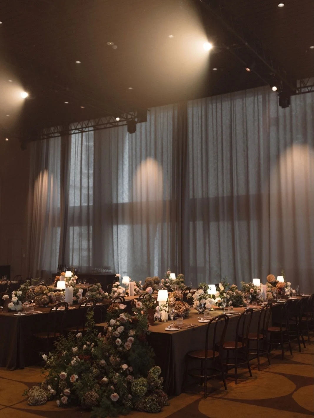 V+C&rsquo;s reception at Ivy Ballroom unfolded as a richly layered celebration &ndash; where deep chocolate tones, soft candlelight and tailored detailing set a warm, inviting mood.

Inspired by a quiet nod to Ralph Lauren elegance, the space was gro