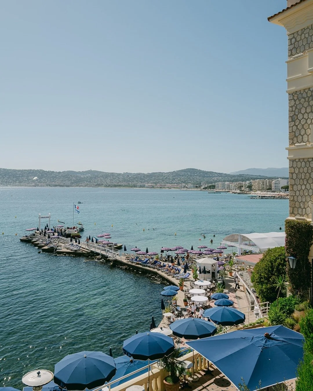 H&ocirc;tel Belles Rives, Antibes. 

A celebration designed almost entirely around the Mediterranean &ndash; ceremony at the water&rsquo;s edge, layers of blue and green hydrangea, toile and crisp white linen and dinner with the sea filling every ope