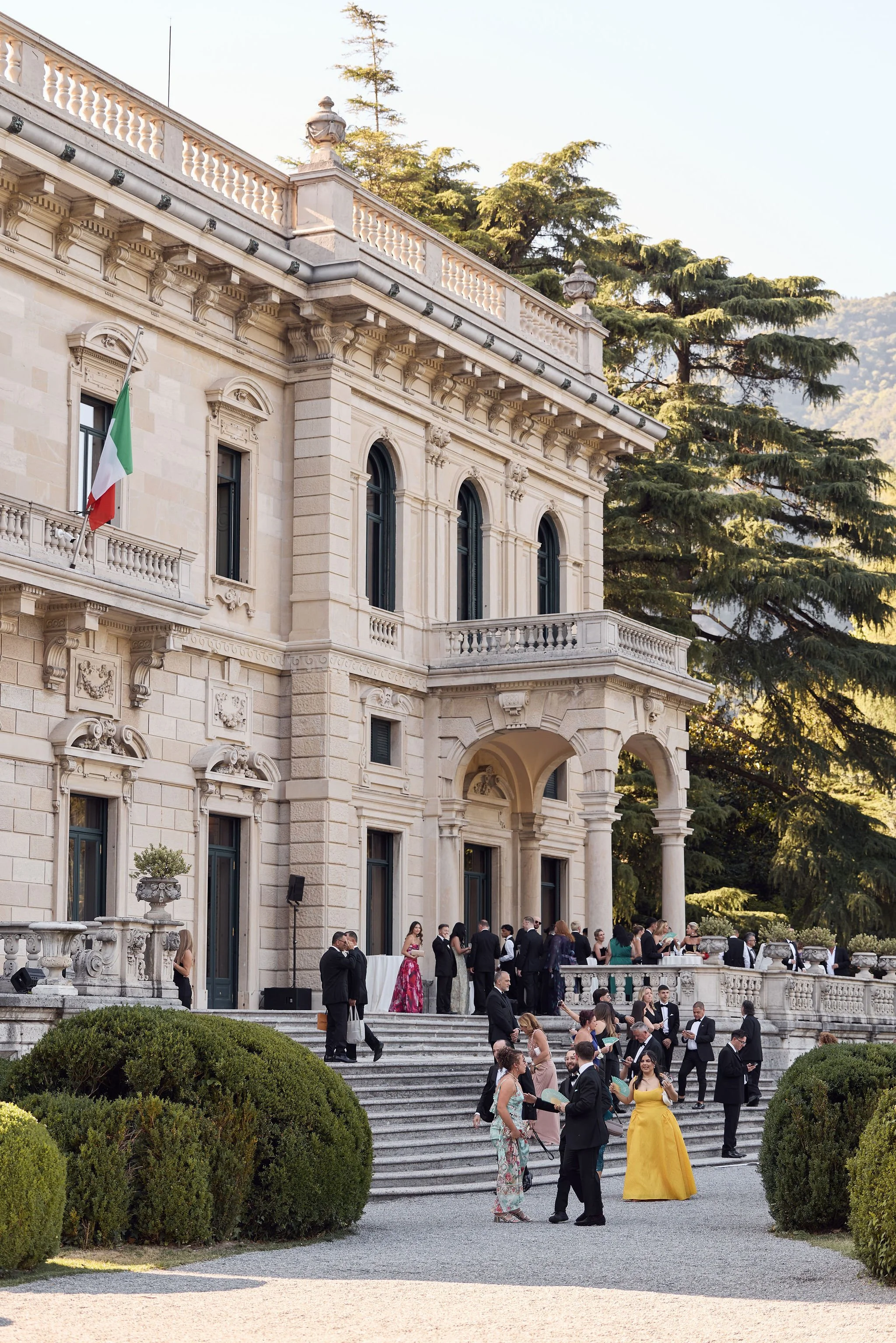 Guests outside Villa Erba overlooking the lake.
