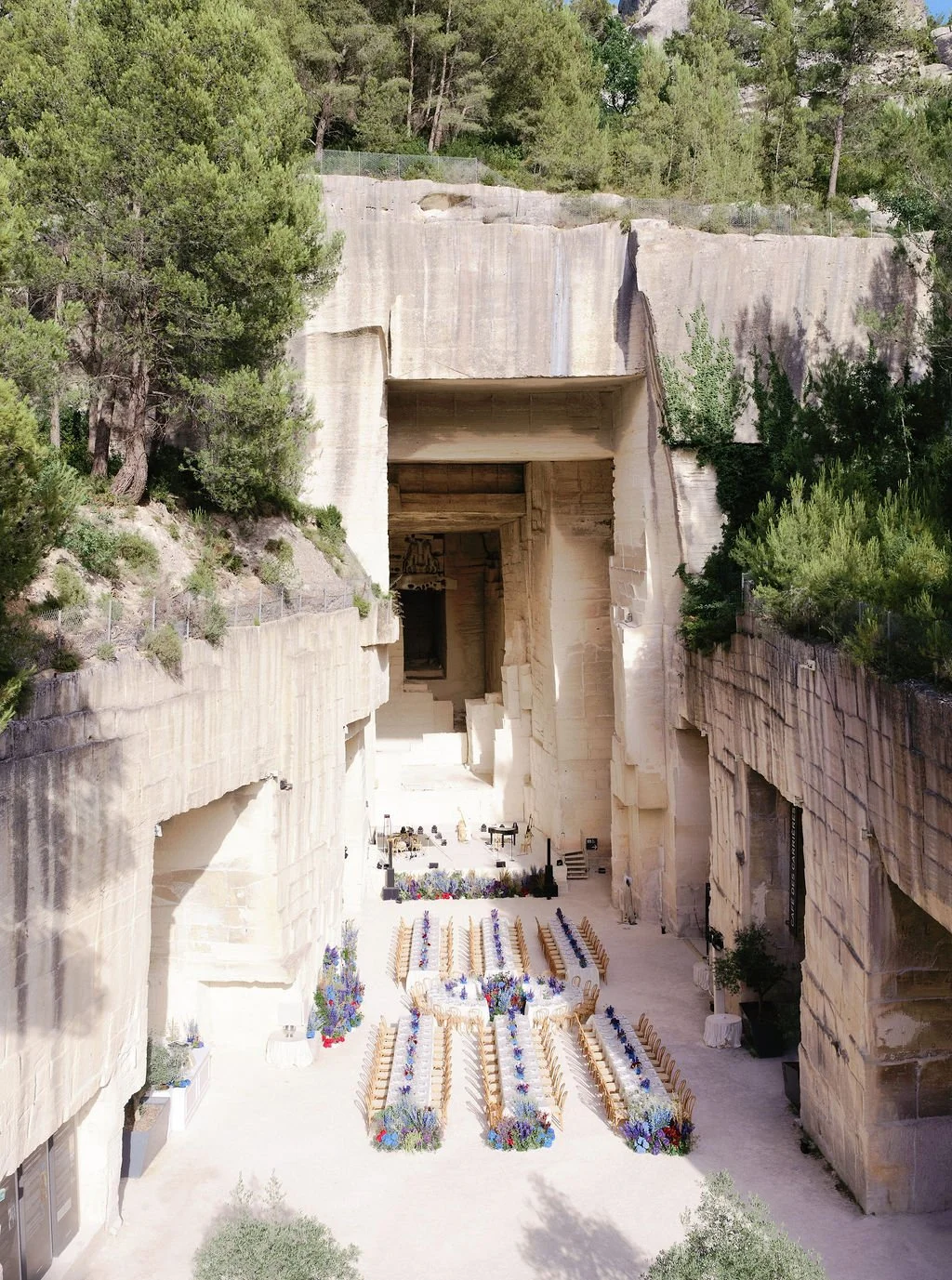 Outdoor wedding setup with rows of chairs and floral arrangements at the Cliff Palace in Colorado.