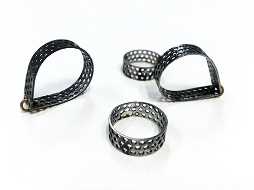 perforated rings and drop shape earrings