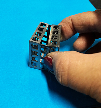 grid square brooch with hand.jpg