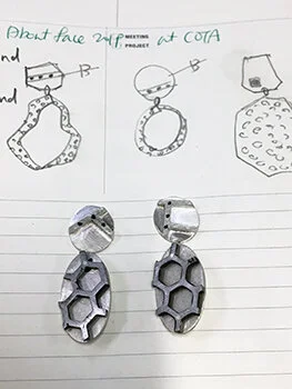 A couple of idea sketches with finished form to be.