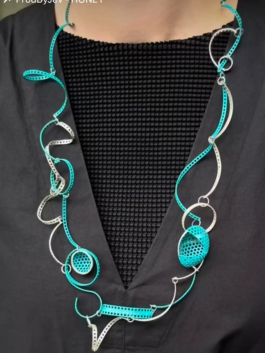 Deep Pool 
Powder-coated perforated mild steel, silver

Deep Pool is an interwoven piece of silver and mild steel, its surface finished in a powder-coated colour named after the work itself &mdash; Deep Pool. The piece draws from my love of swimming,