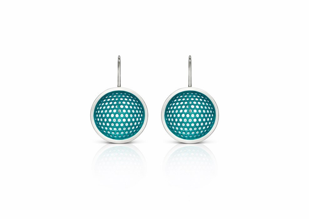 Turn heads and make a statement with these elegant teal perforated earrings, designed to enhance any outfit with their unique charm and sophistication.

Crafted with high-quality sterling silver for durability and elegance.

Features a unique perfora