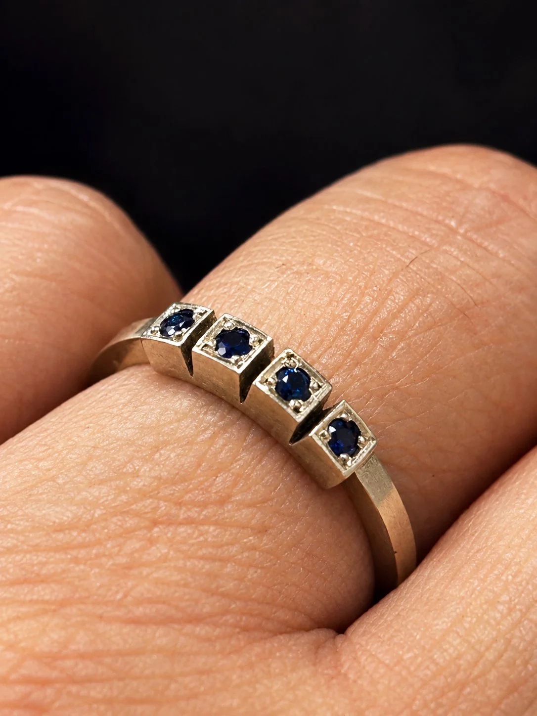white gold with 4 sapphires ring worn.jpg