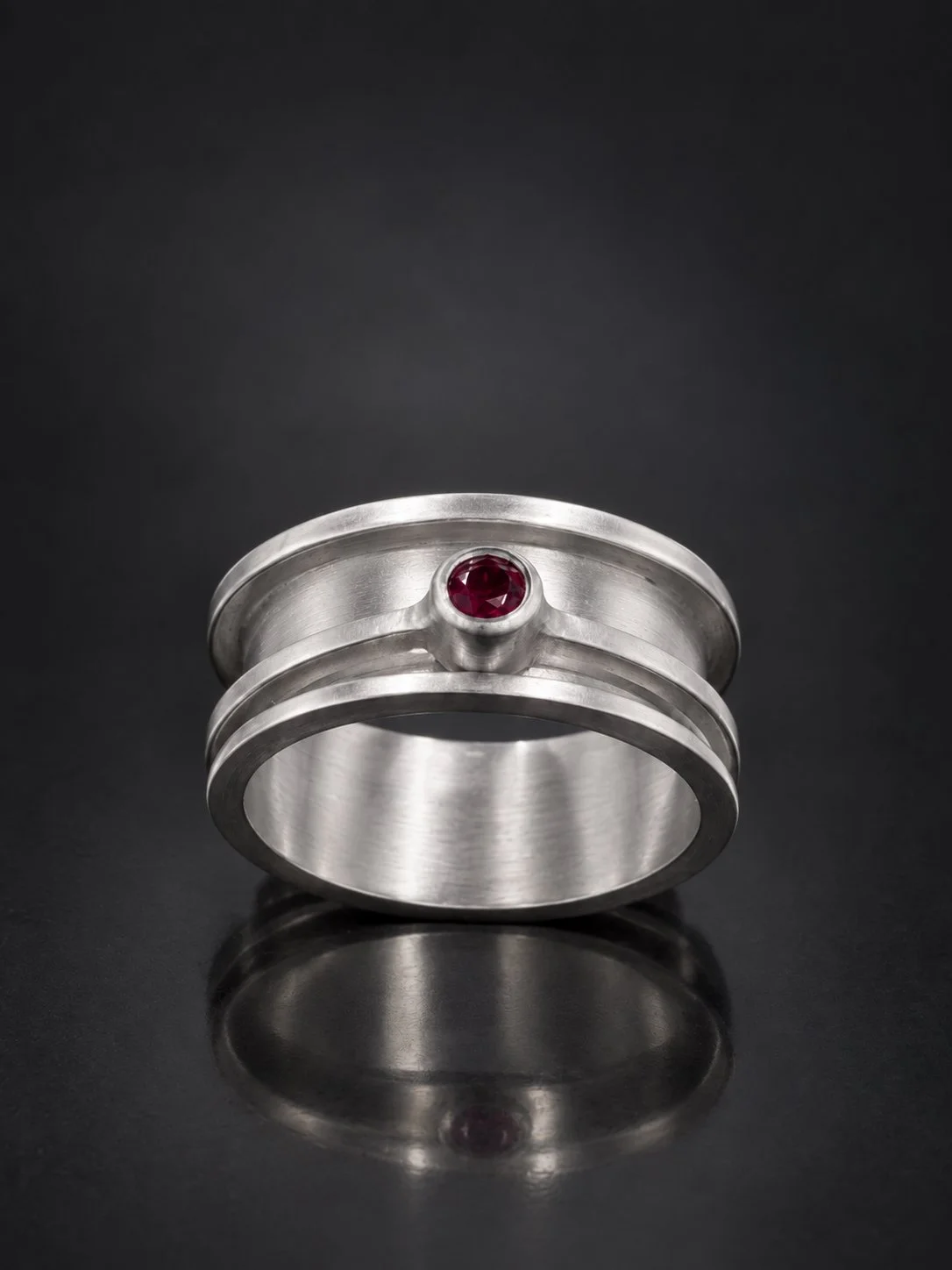 Satin Silver Ring with Ruby Bezel.jpg