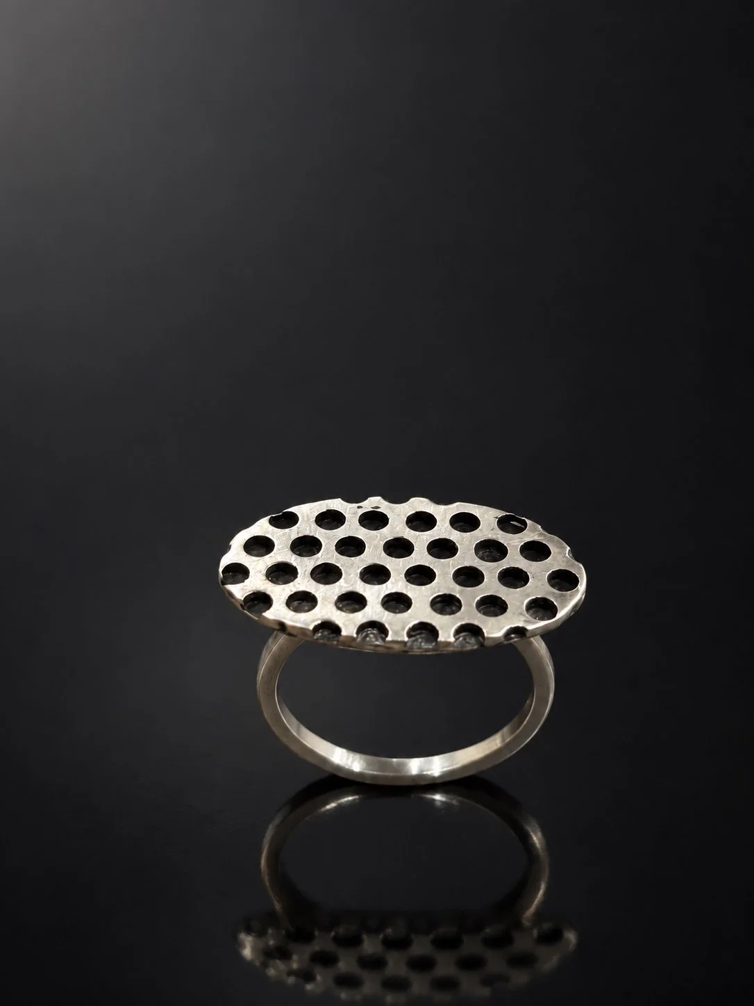 Perforated Silver Ring on Glossy Black.jpg