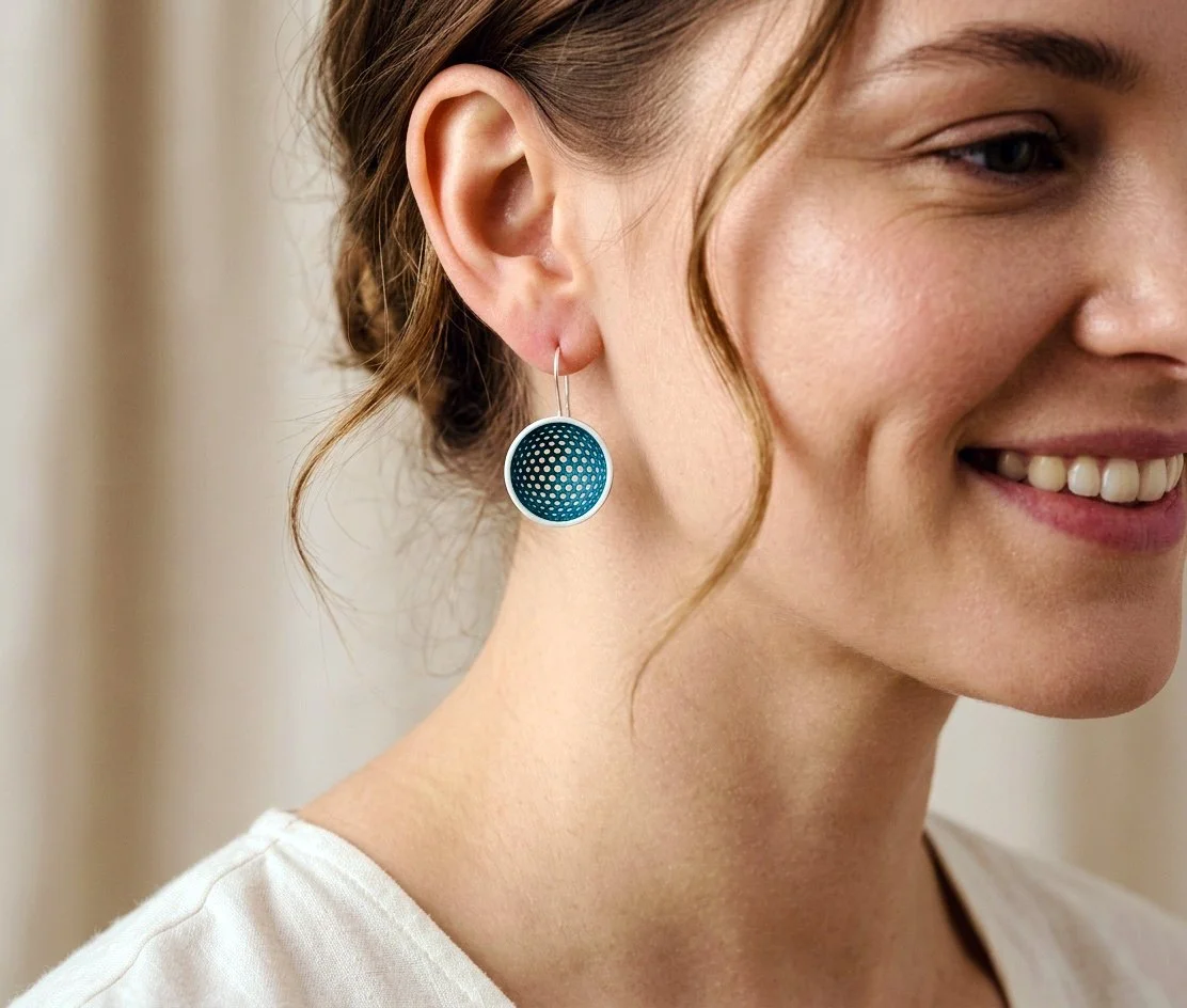 teal cup worn on a model.jpg