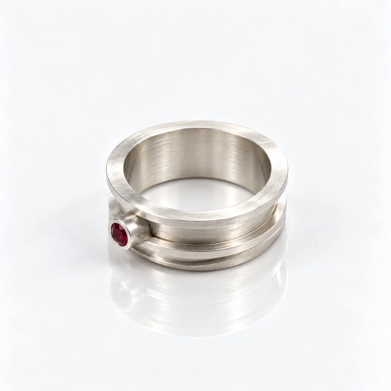 Minimalist Silver Ring with Ruby Accent.jpg