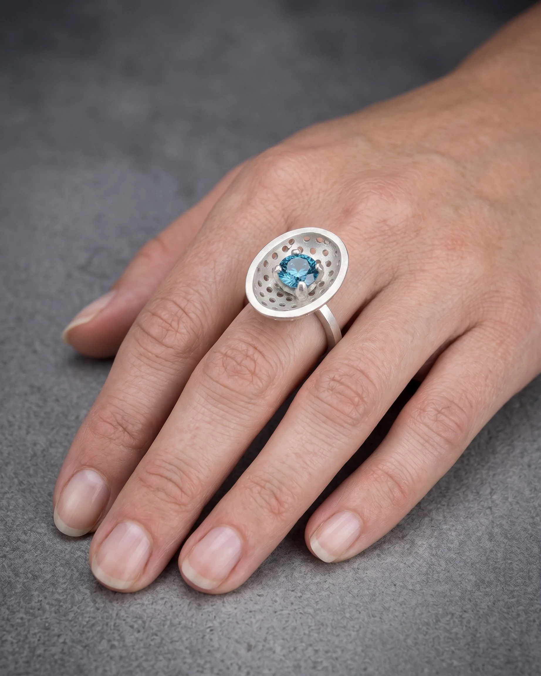 sky blue topaz worn.jpg