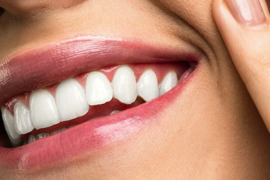 Close up pf a woman's mouth with healthy teeth and gums