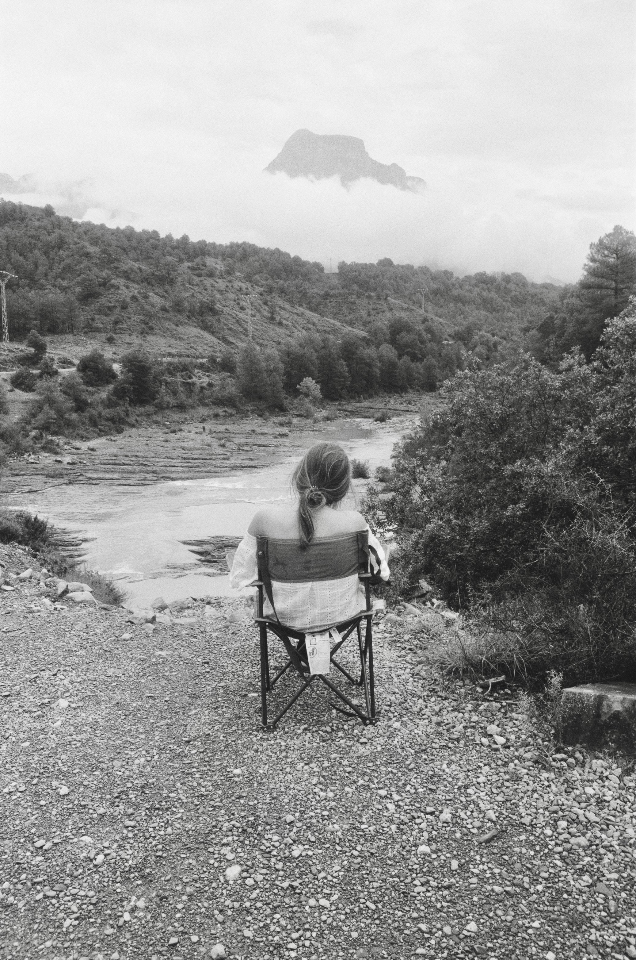 Amelia reading on campervan trip in pyrenees