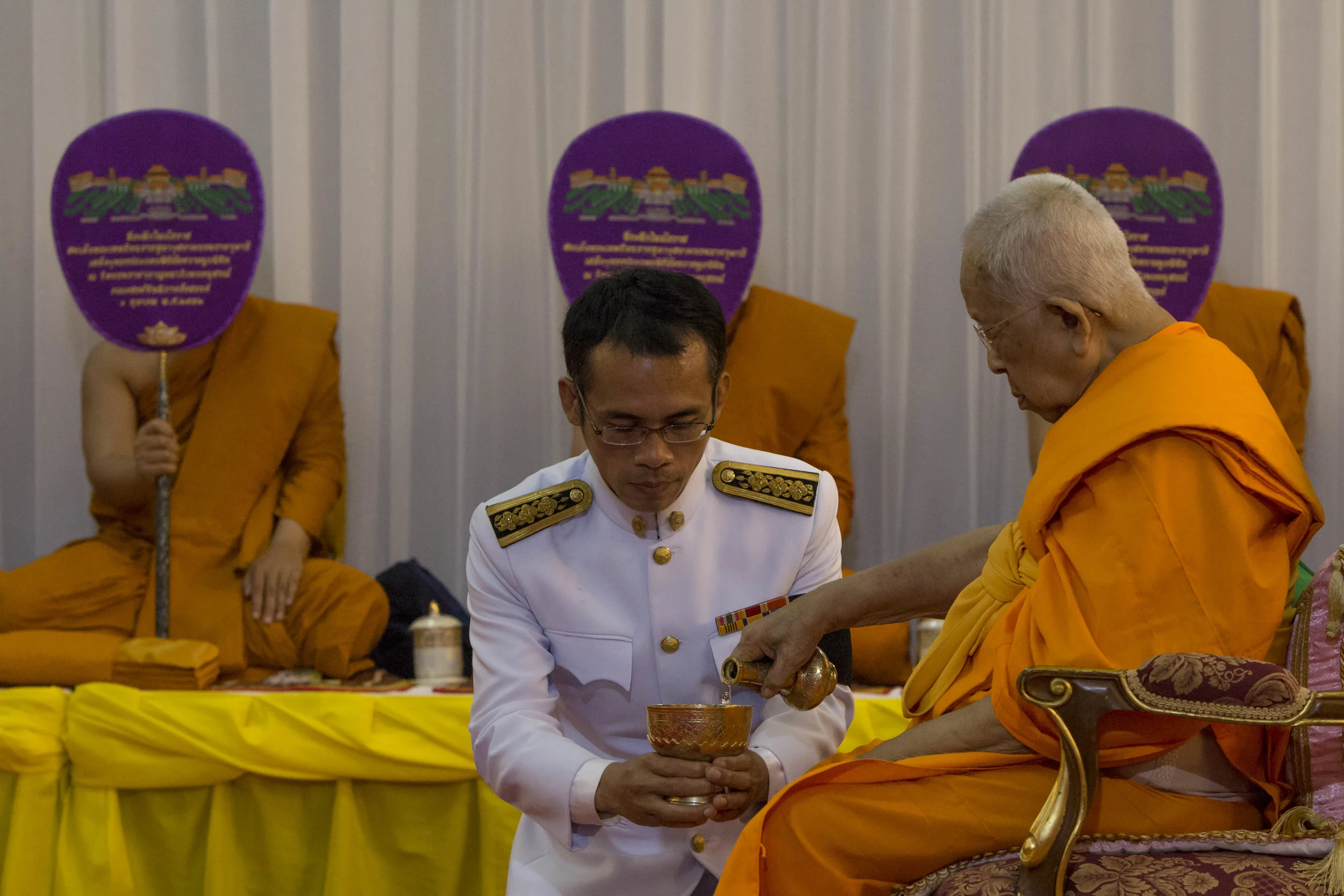 Supreme Patriarch Somdet Phra Maha Ratchamangalacharn pours holy water to be used during the funerary bathing ritual