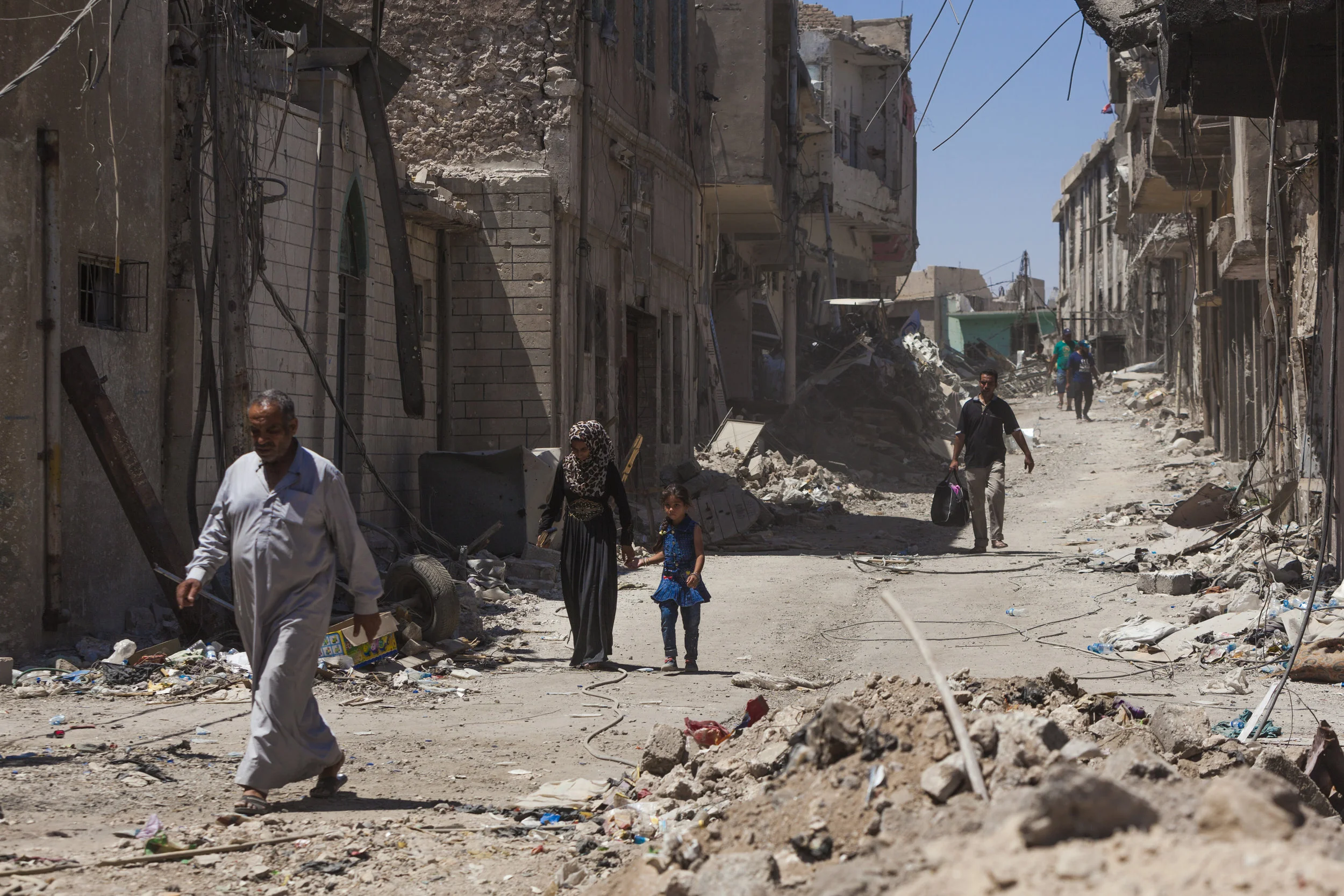 Residents of the Old City return from visiting their destroyed homes, salvaging whatever they can but often coming back empty handed