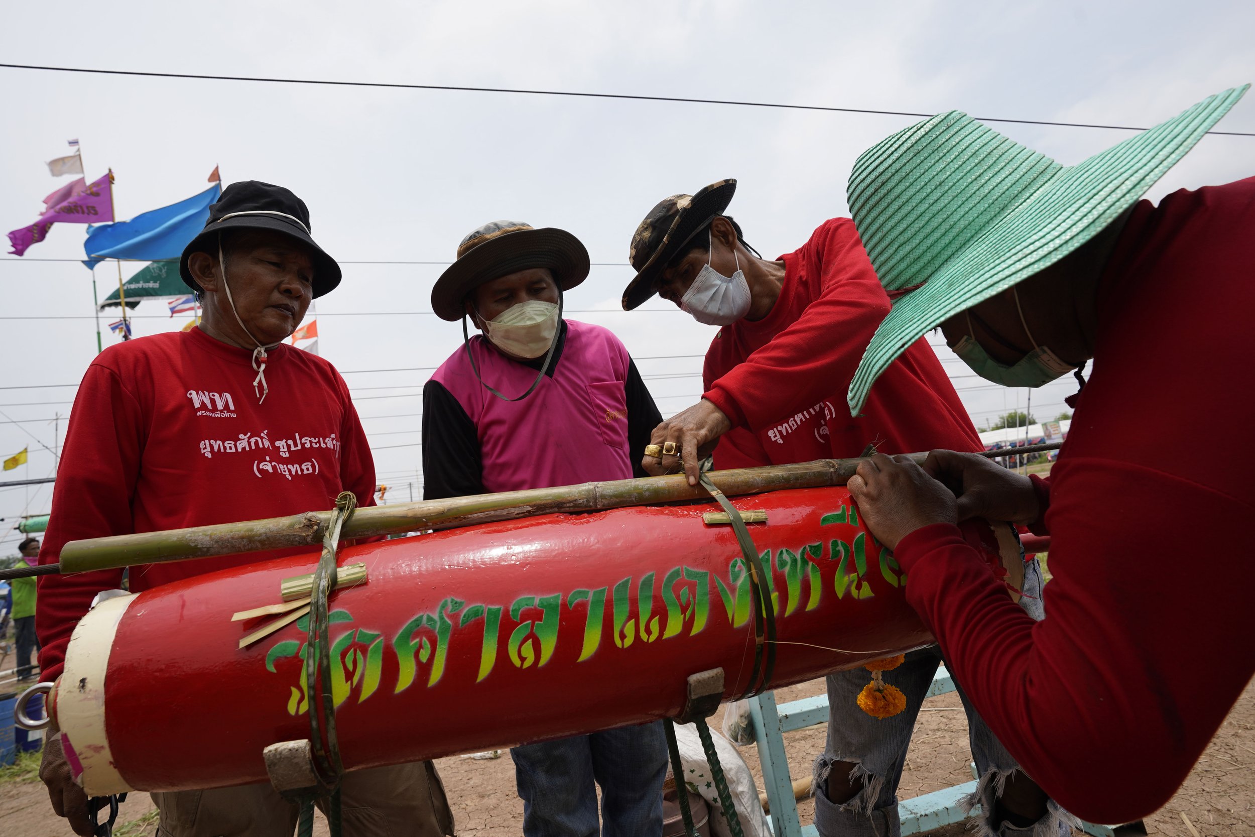 May 1, 2022: Team members work to fasten their rocket to it’s bamboo guide before launch.