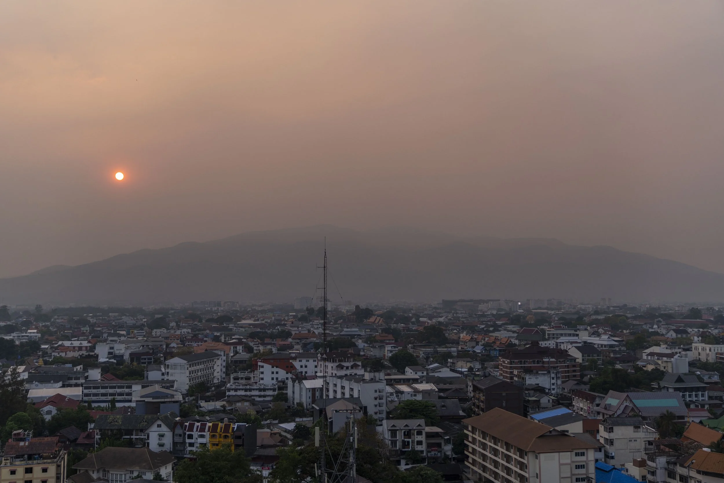 April 2, 2024: A thick blanket of pollution hangs over Chiang Mai, Thailand, brought on by numerous wildfires burning in the surrounding hills and mountains. The northern city is renowned world wide a travel hotspot, though the persistent haze has