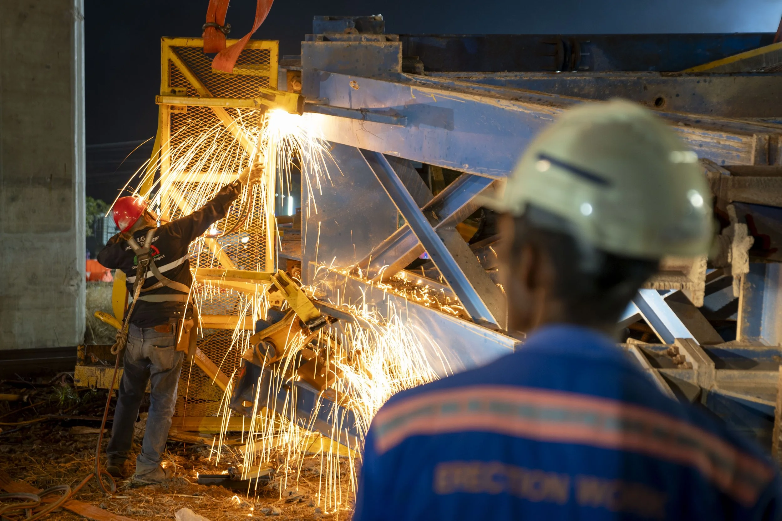  JANUARY 14, 2026: Construction workers are working to remove a construction crane which it collapsed onto a passenger train in Nakhon Ratchasima, Thailand on January 14, 2026. At least 32 people were killed and some 64 others injured on Wednesday af