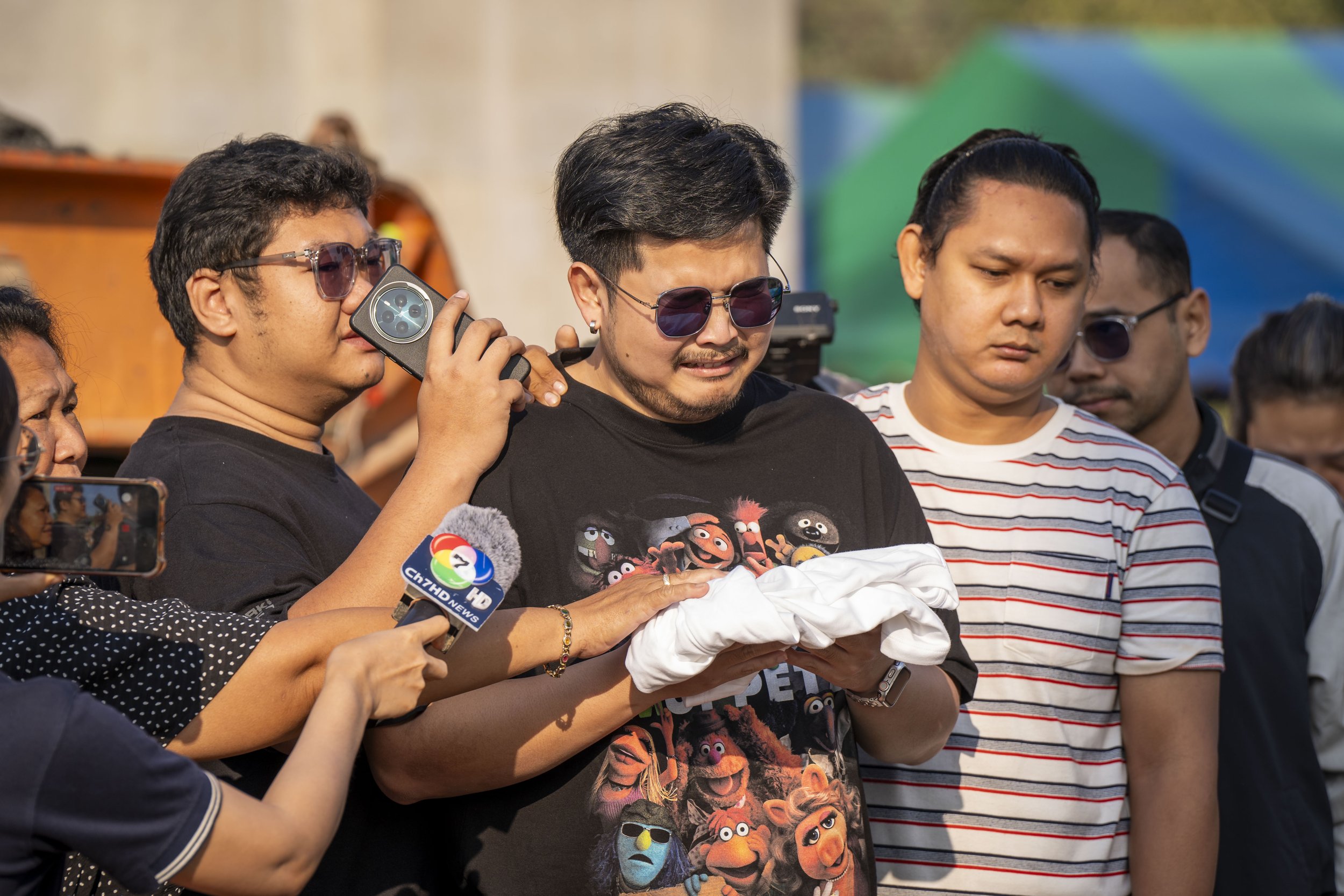  January 15, 2026: A loved one of a deceased victim of the train disaster stands near the site the morning after the tragedy and calls on the spirit of his relative to come home - for Anadolu Agency 