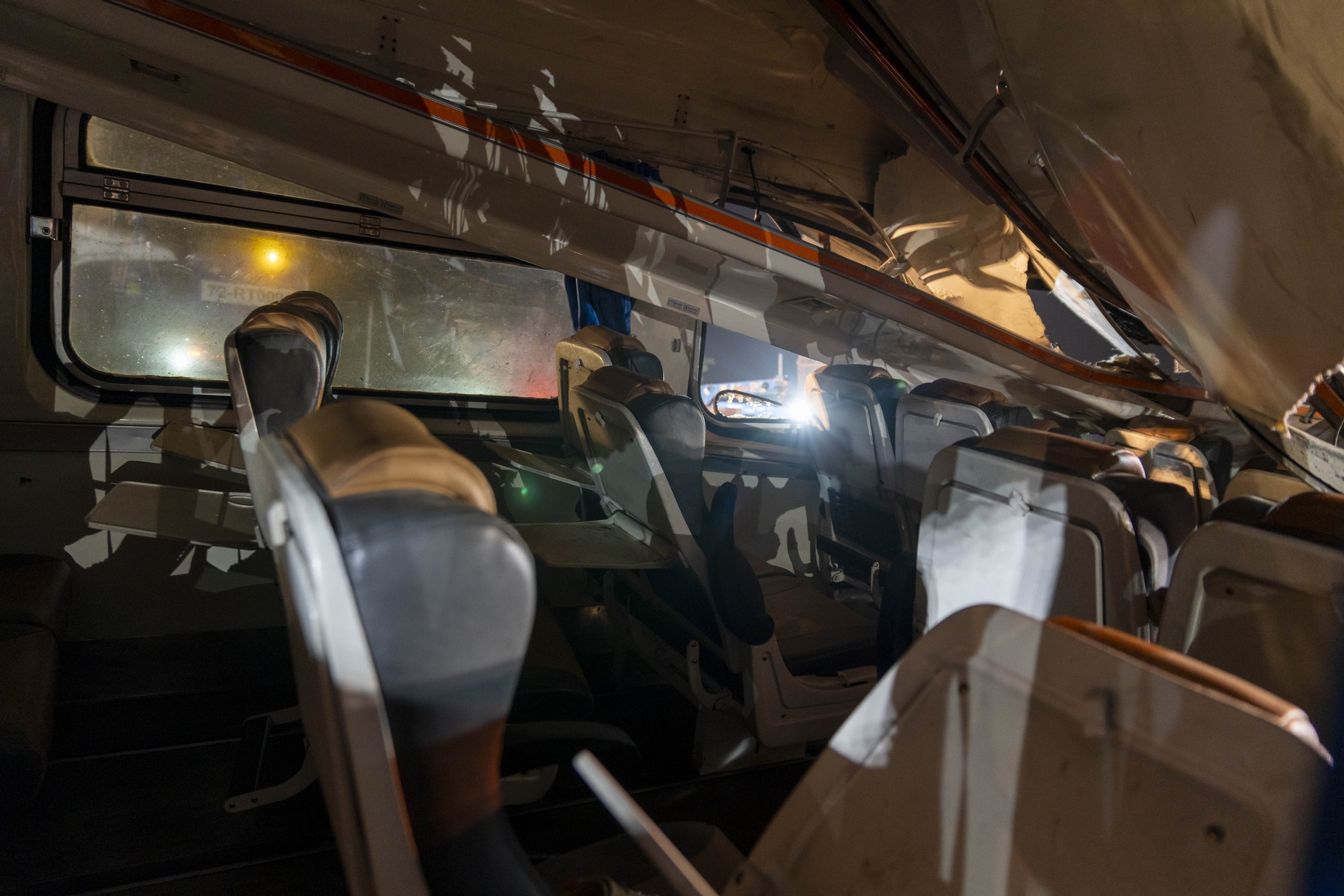  January 14, 2026: The interior of a heavily damaged train car which was crushed by a falling crane while the train was was moving underneath the Thai-Chinese high speed rail construction site, approximately 12 hours after the disaster which claimed 