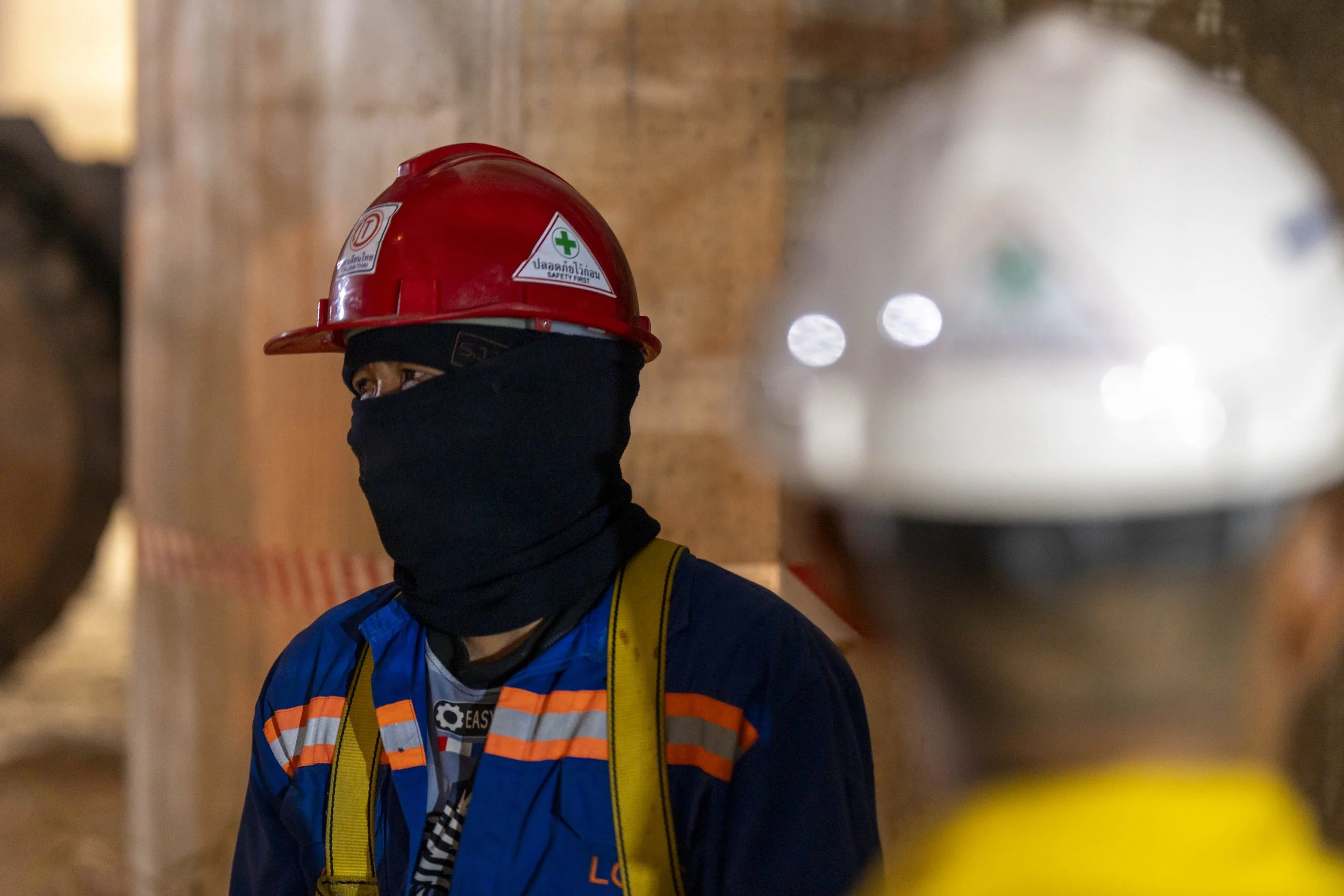  January 14, 2026: A construction worker looks on at the site  where a train car which was crushed by a falling crane while the train was was moving underneath the Thai-Chinese high speed rail construction site, approximately 12 hours after the disas