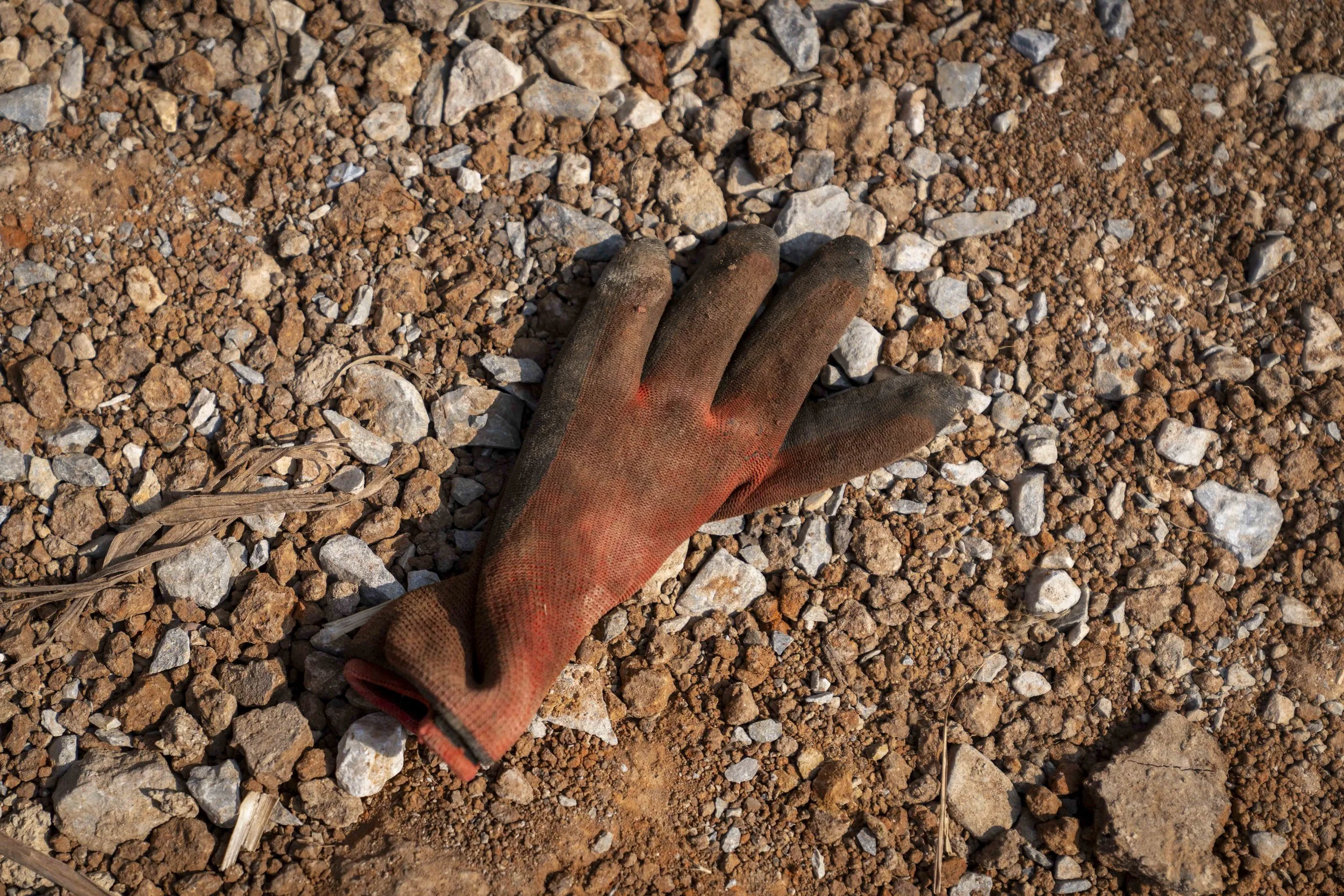  January 15, 2026: A discarded construction workers glove lays on the ground near the site of the train derailment the morning after the day of the tragedy - for Anadolu Agency  