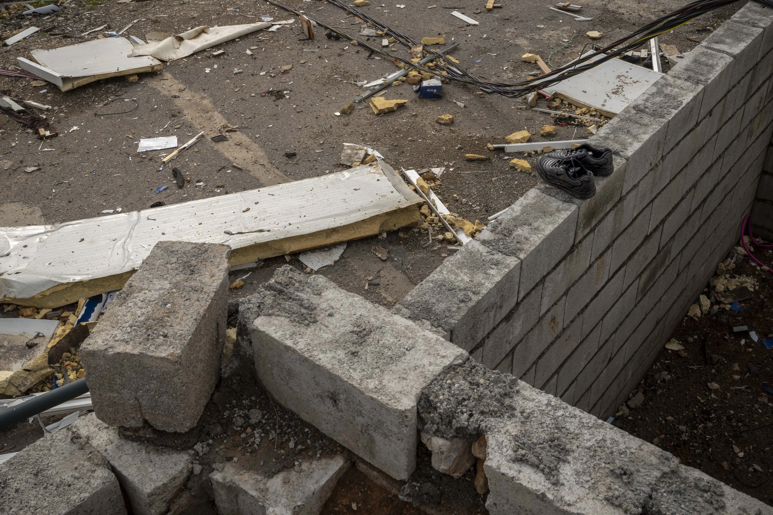  The shoes which belonged to Ghazal Moulan, placed neatly near the site where she was critically injured by the April 14 Iranian shahed drone strike. 