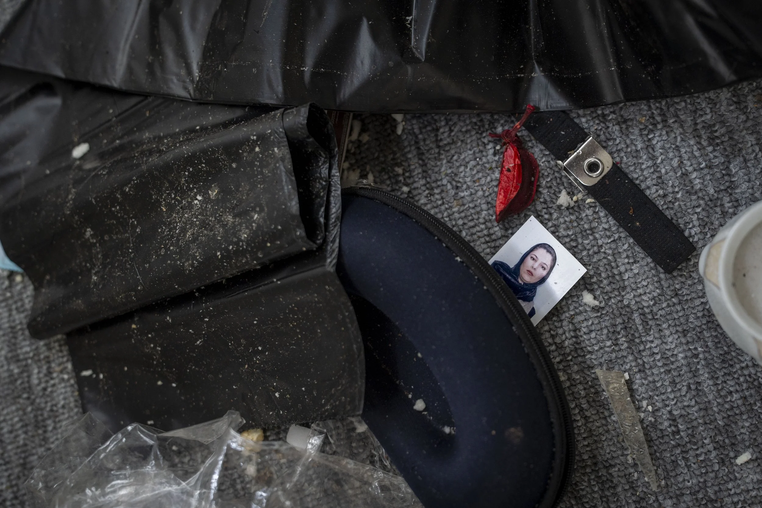  A photo lays on the floor of one of the damaged buildings in the Surdash Komala camp which was damaged by the April 14 Iranian shahed drone attack. 