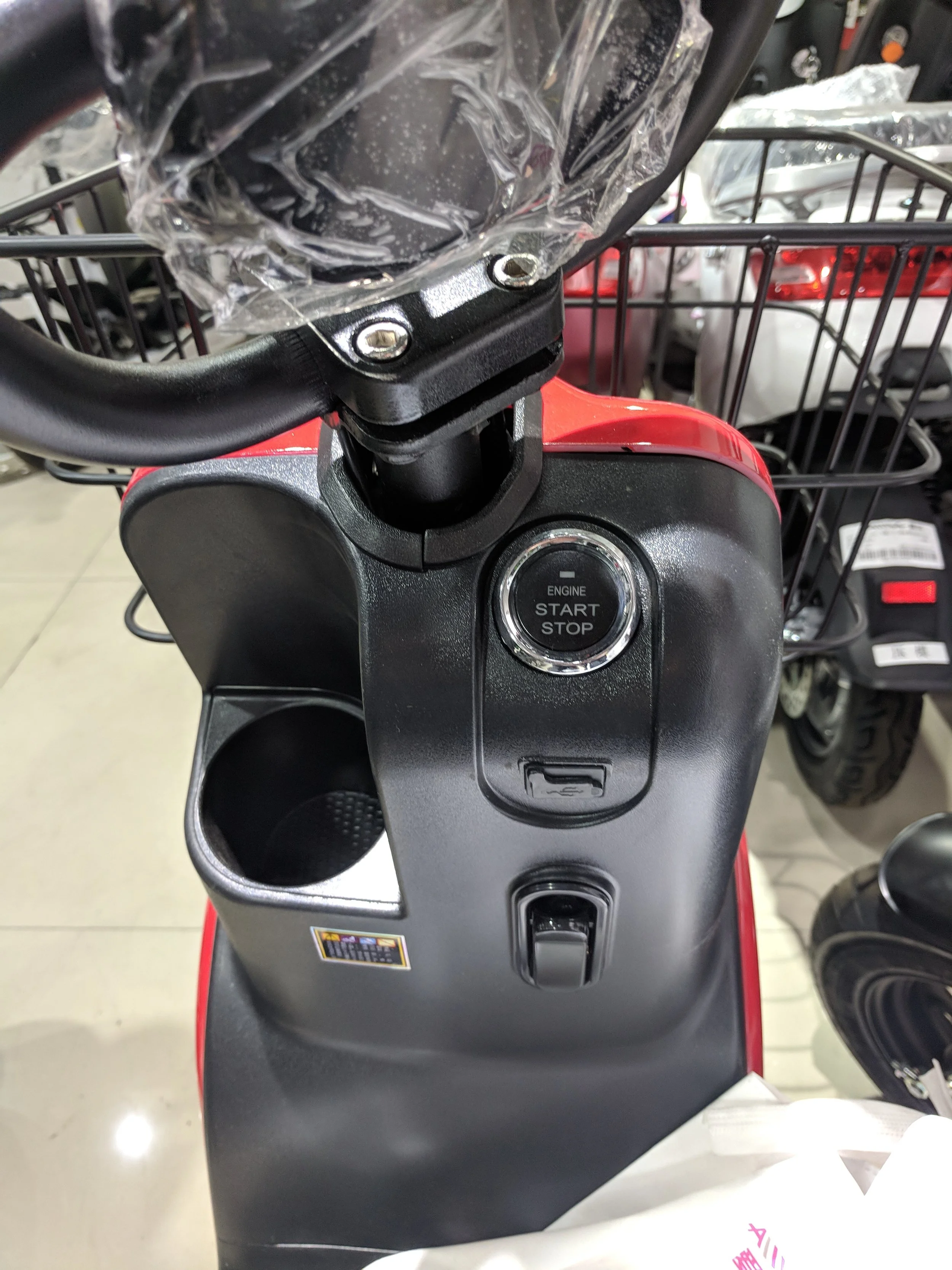Uncommon push button start, and a very American looking cup holder for your Starbucks Frappuccino.