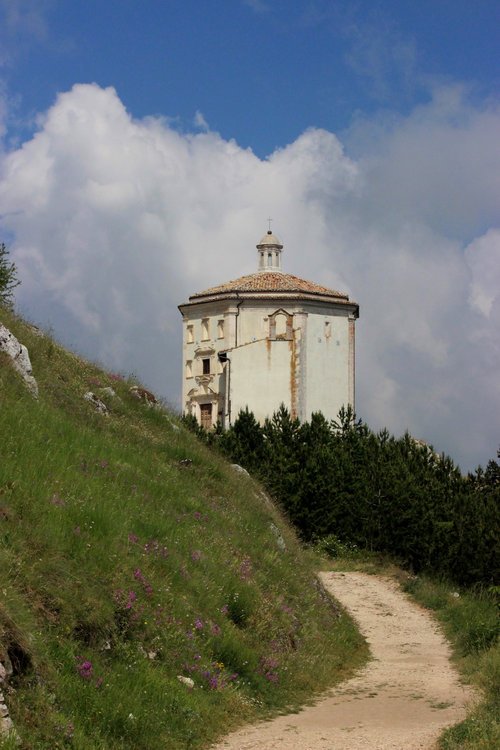 The church of Santa Maria delle Pieta below Rocca Calascio, the highest fortress in the Apennine Mountains in Abruzzo Italy.