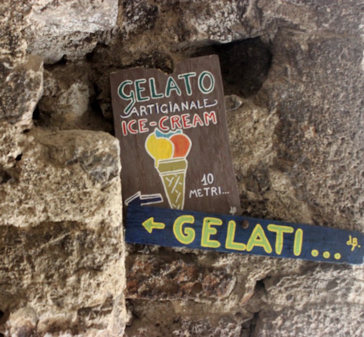 Gelato entrance sign leading to a sweet treat in Castelvecchio Italy. 