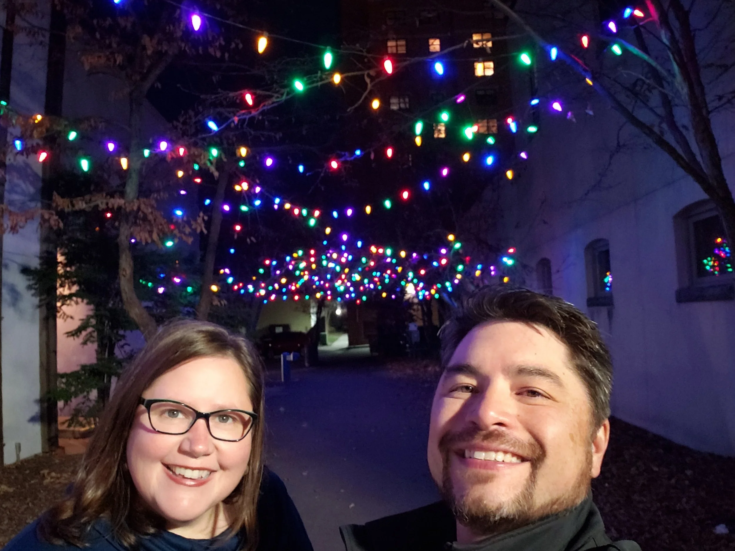 Megan and her husband Kent out enjoying the pretty lights in a courtyard in Red Wing, MN