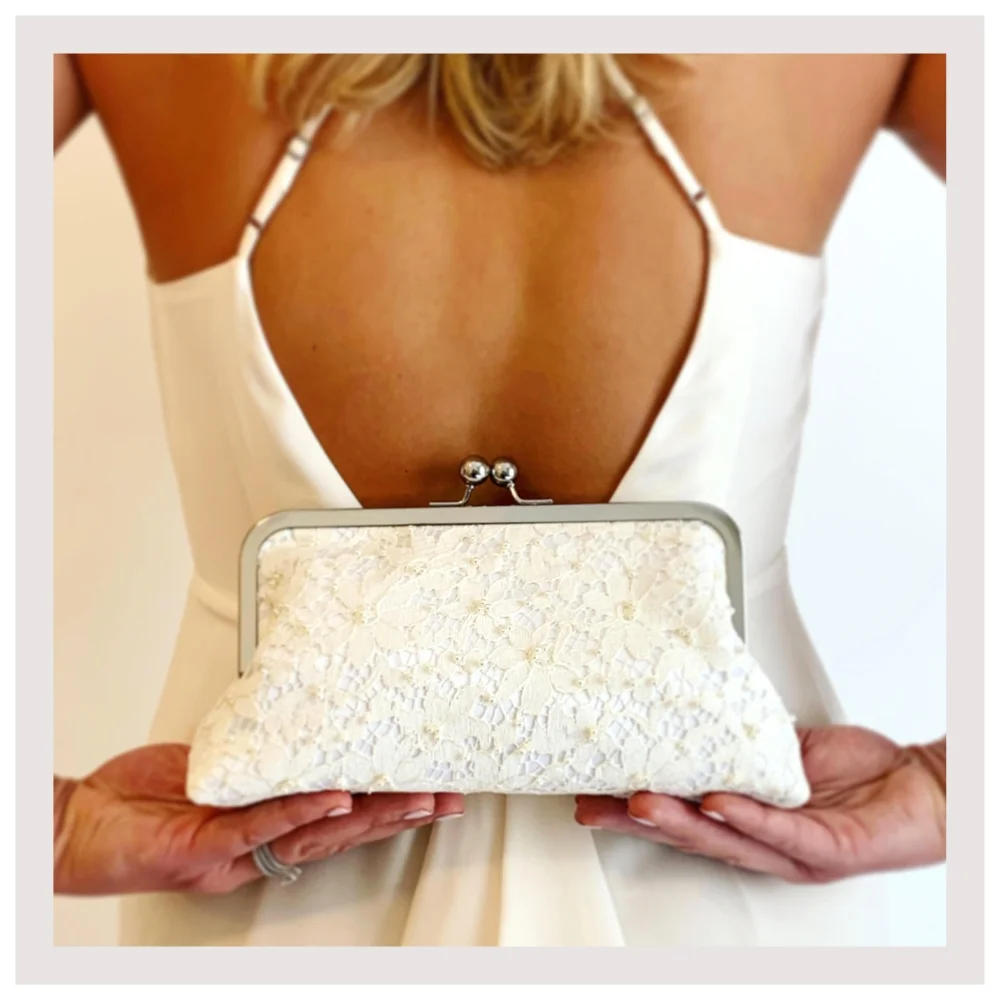 bride with back holding wedding clutch.jpg