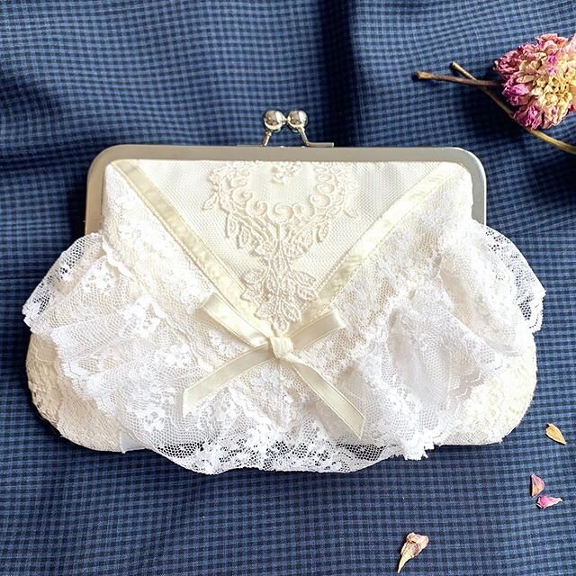 I worked with Jessica and her Godmother on her wedding clutch and we included so many heartfelt details! Jessie wanted the front to really encompass the ruffles main part of the dress and we I think we accomplished that while also adding some special