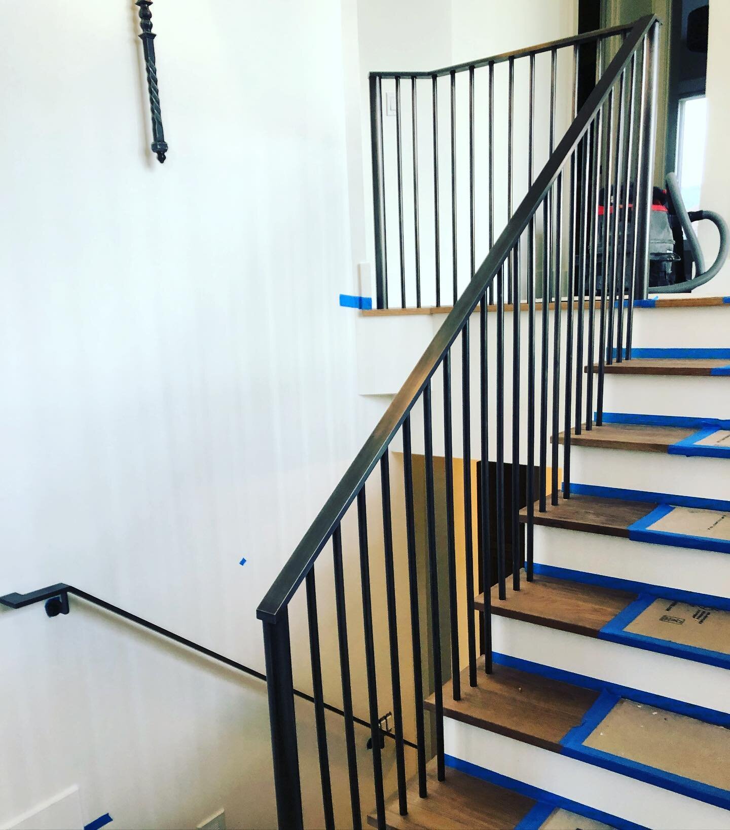 Blackened steel handrail and guardrail with buried anchors for a private residence in Kirkland.