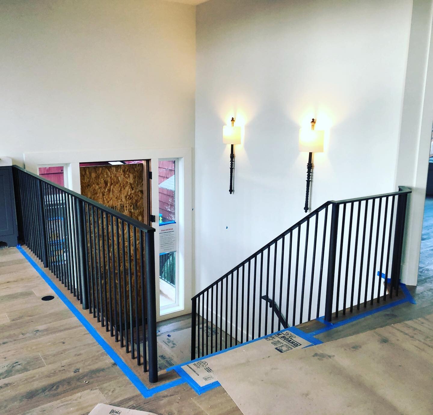 Blackened steel handrail and guardrail with buried anchors for a private residence in Kirkland.