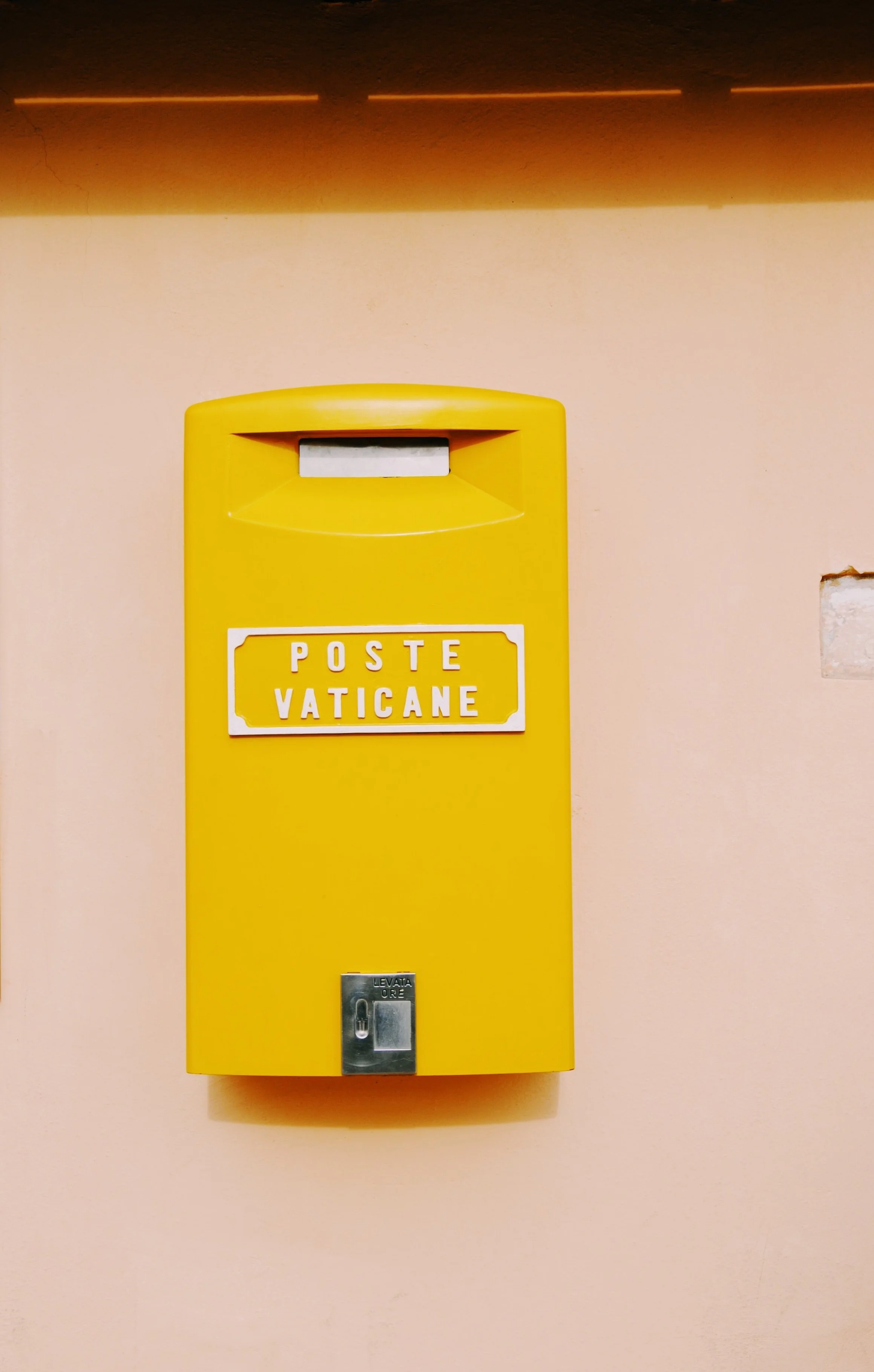 Top the Dome: Mail your letters using the beautiful yellow Vatican post office mailbox