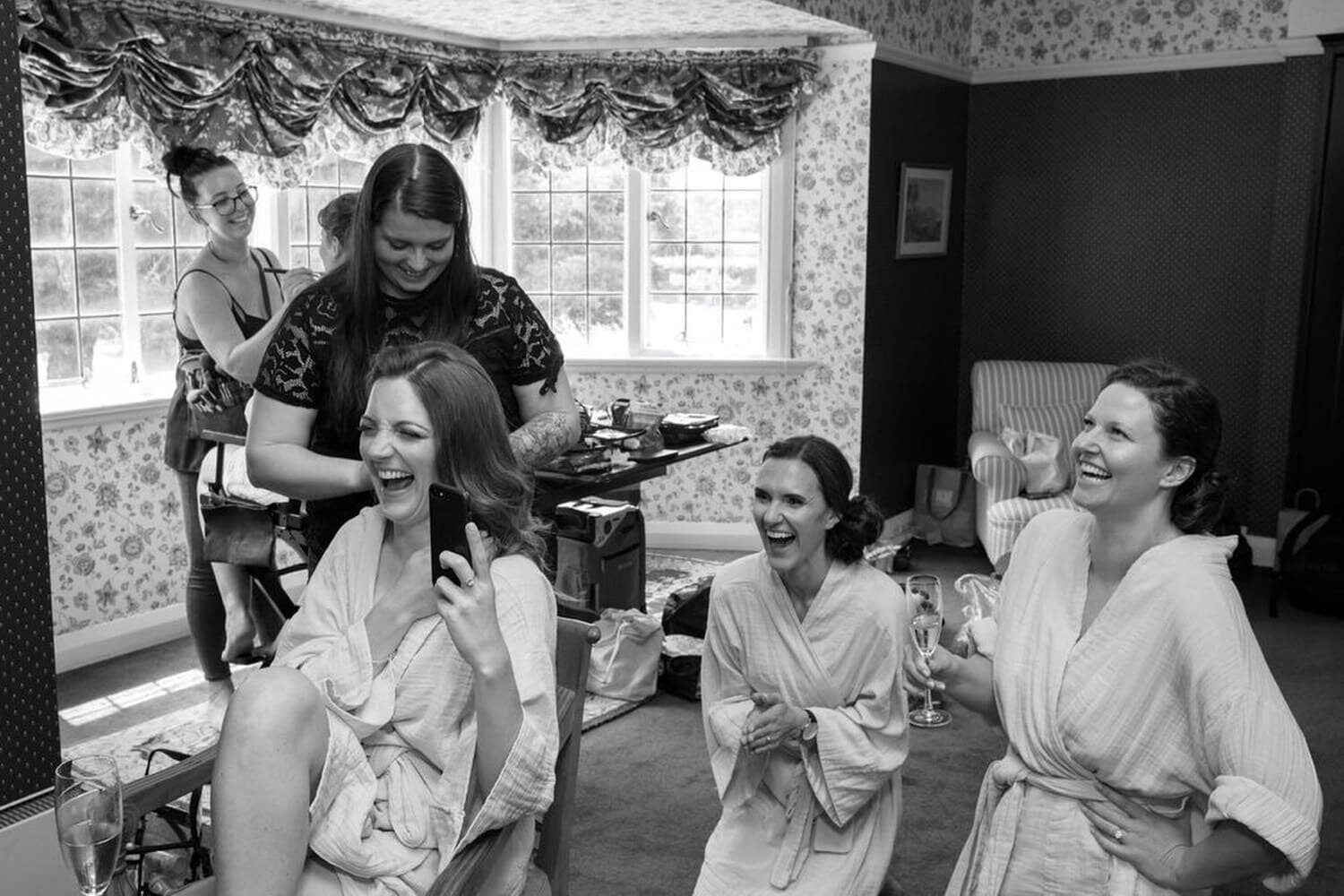 02_wairarapa-wedding-longwood-jessDewsnap01_bride and bridesmaids laugh as they get ready on the big day. .jpg