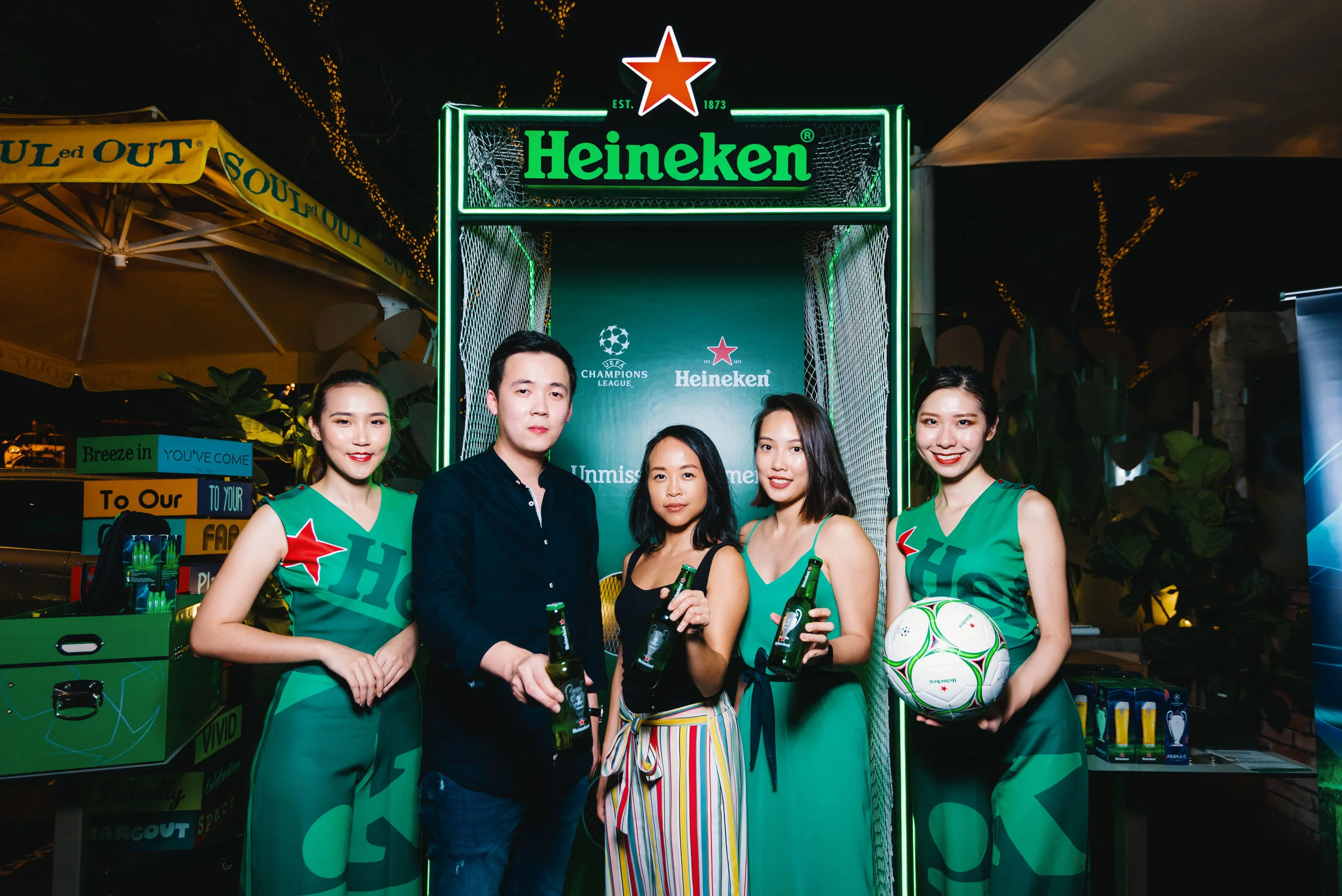  [L-R] Jacob Siau (邵荣锋) - Junior Brand Manager of Heineken® Malaysia, Carmen Chong(张佩雯) - Senior Brand Manager of Heineken® Malaysia, and Stephanie Chin (曾佩仪) - Brand Manager of Heineken® Malaysia posing for a picture with the Heineken® Limited Edition UEFA Champions League Trophy Bottles at the Heineken® Extra-Time Zone. 