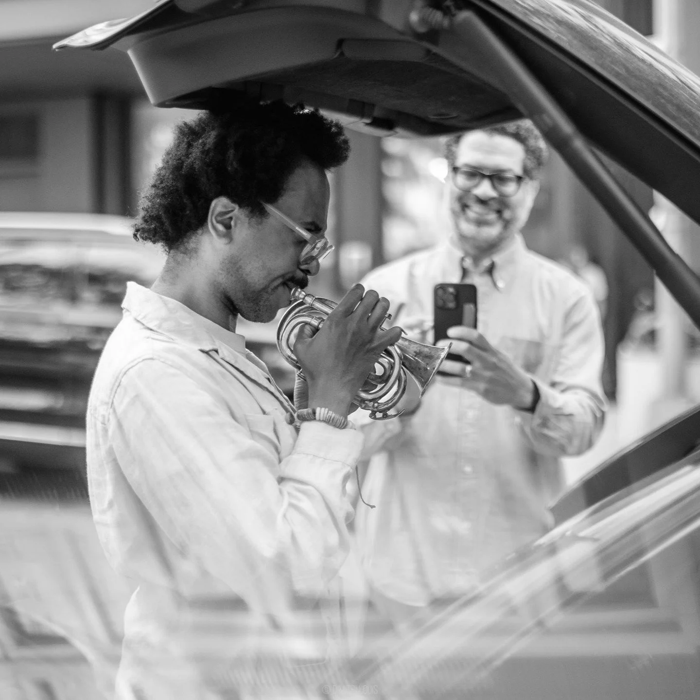 Trumpeter Jonathan Finlayson trying out a pocket trumpet, while Jason Moran captures the scene. 

#JonathanFinlayson #JasonMoran #AtelierHarlem #JazzLife #PocketTrumpet #StreetPhotography #JazzLegends #MusicInNYC #HarlemCreatives #BlackAndWhitePhotog