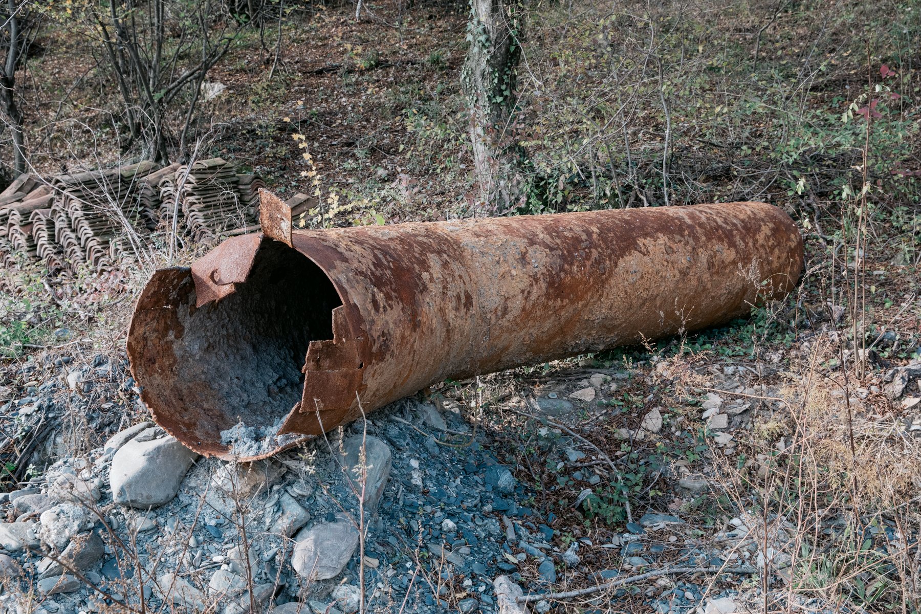  A rusting water pipe lies abandoned near Ilia Lake. 