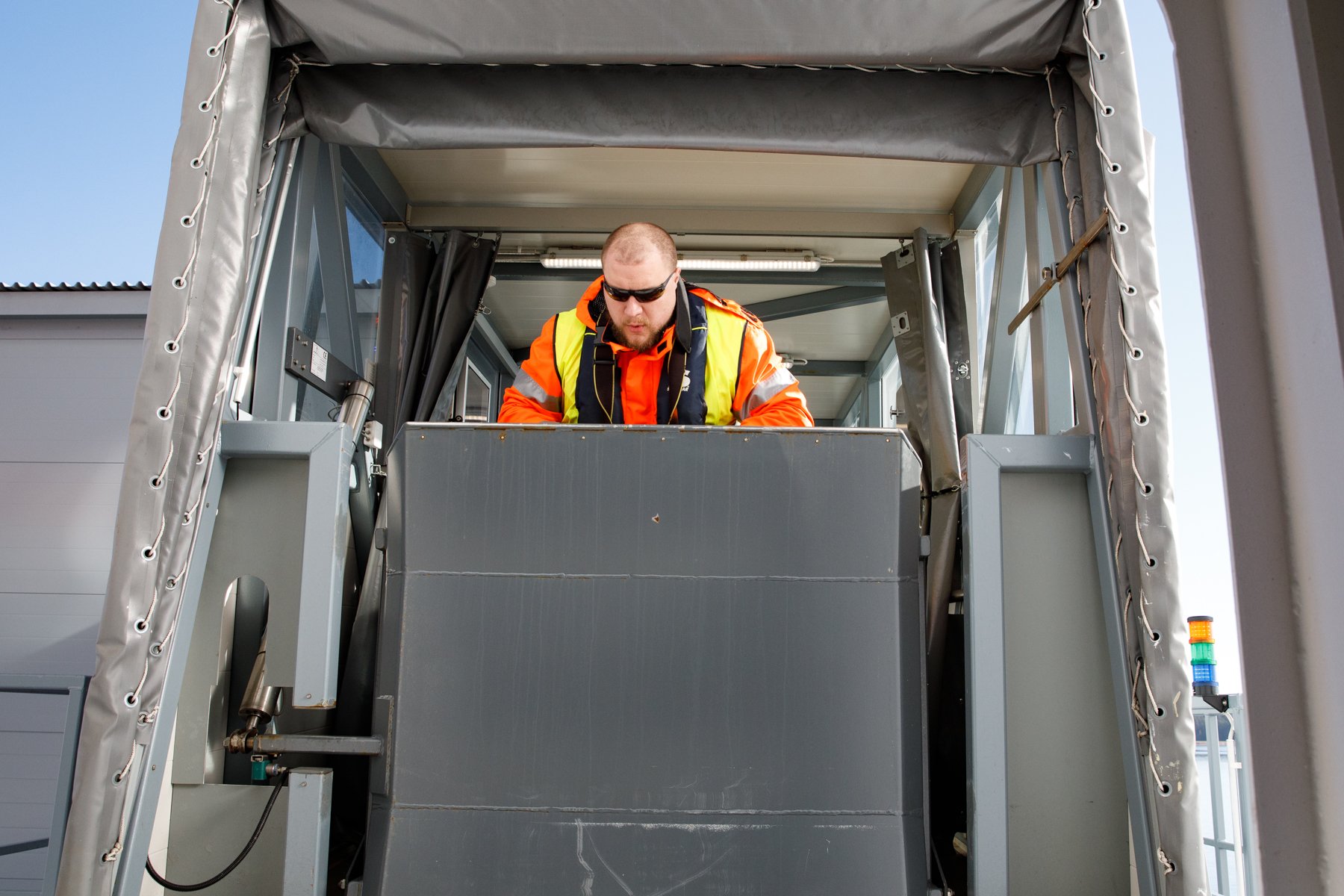  A shore worker guides the gangway to the port side of  Finnlady . 