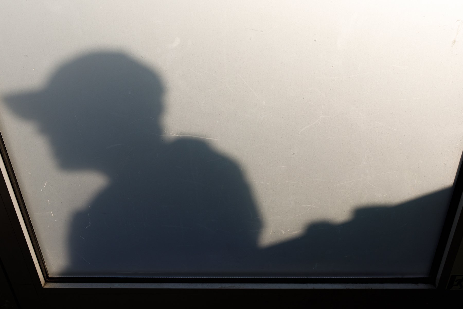  The silhouette of a man on  Urd 's outside deck. 