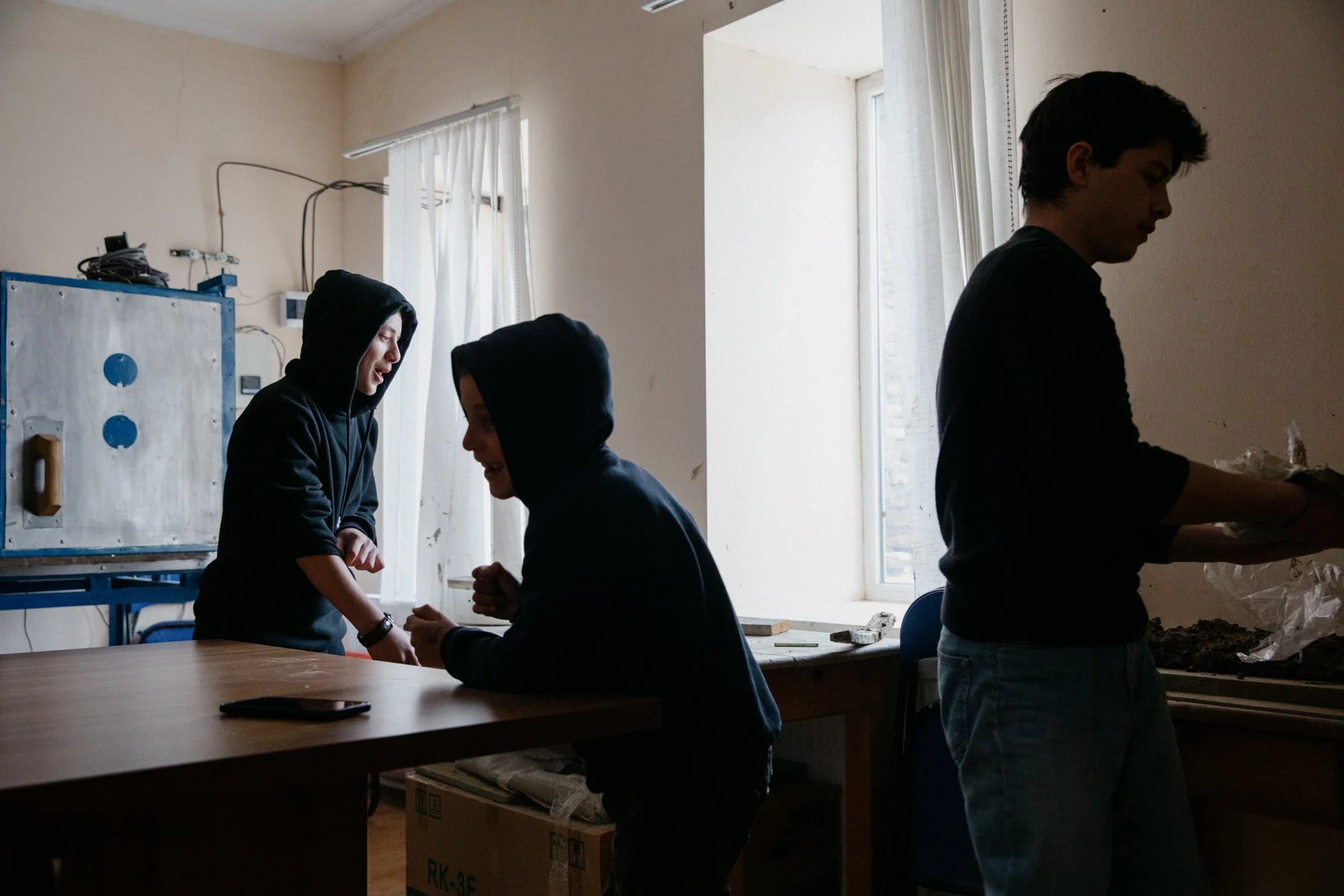 Boys clean up after a pottery session at Nikozi Art School. The school was founded by Isaiah, the Bishop of Nikozi & Tskhinvali, to provide a range of extra-curricular activities including pottery, music and English lessons.