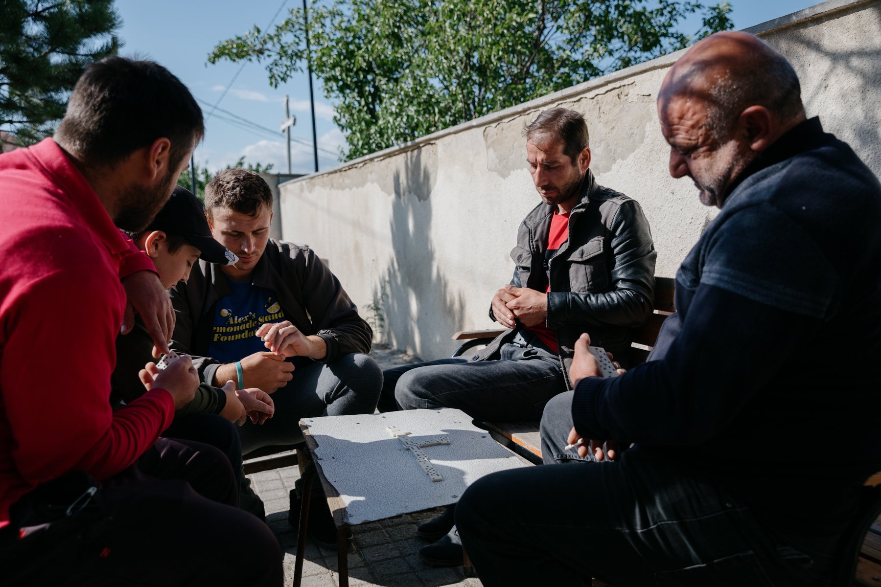  Throughout Georgia, playing dominoes is a popular way to relax after a hard day's work. Dirbi, as with all villages along the occupation line with South Ossetia, relies on growing produce such as apples, tomatoes and cherries. 